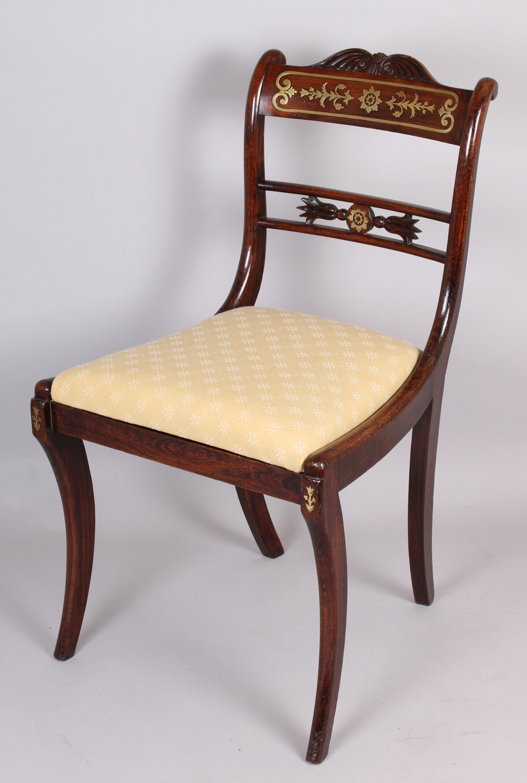 Set of eight early 19th century period simulated rosewood and brass inlaid dining-chairs of classic Regency form