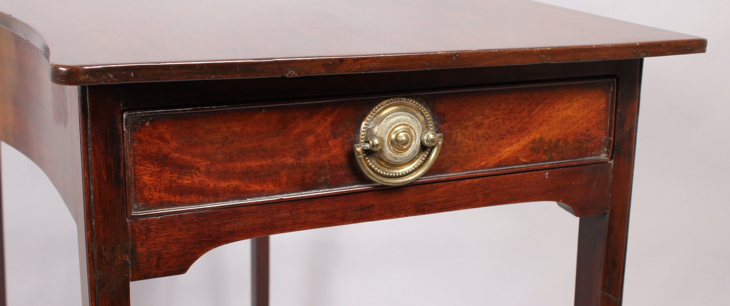 George III period mahogany side-table of simple serpentine form