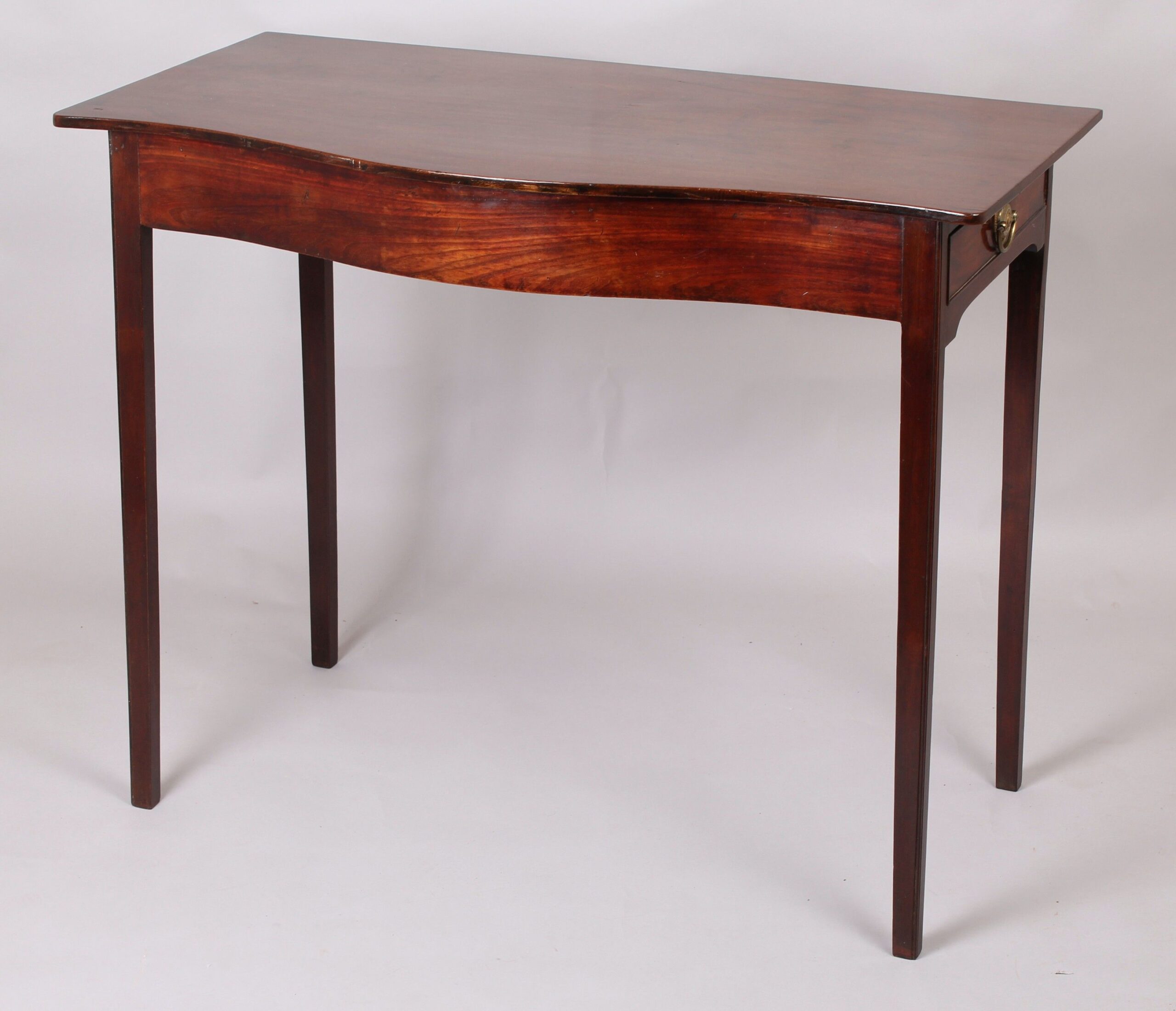 George III period mahogany side-table of simple serpentine form