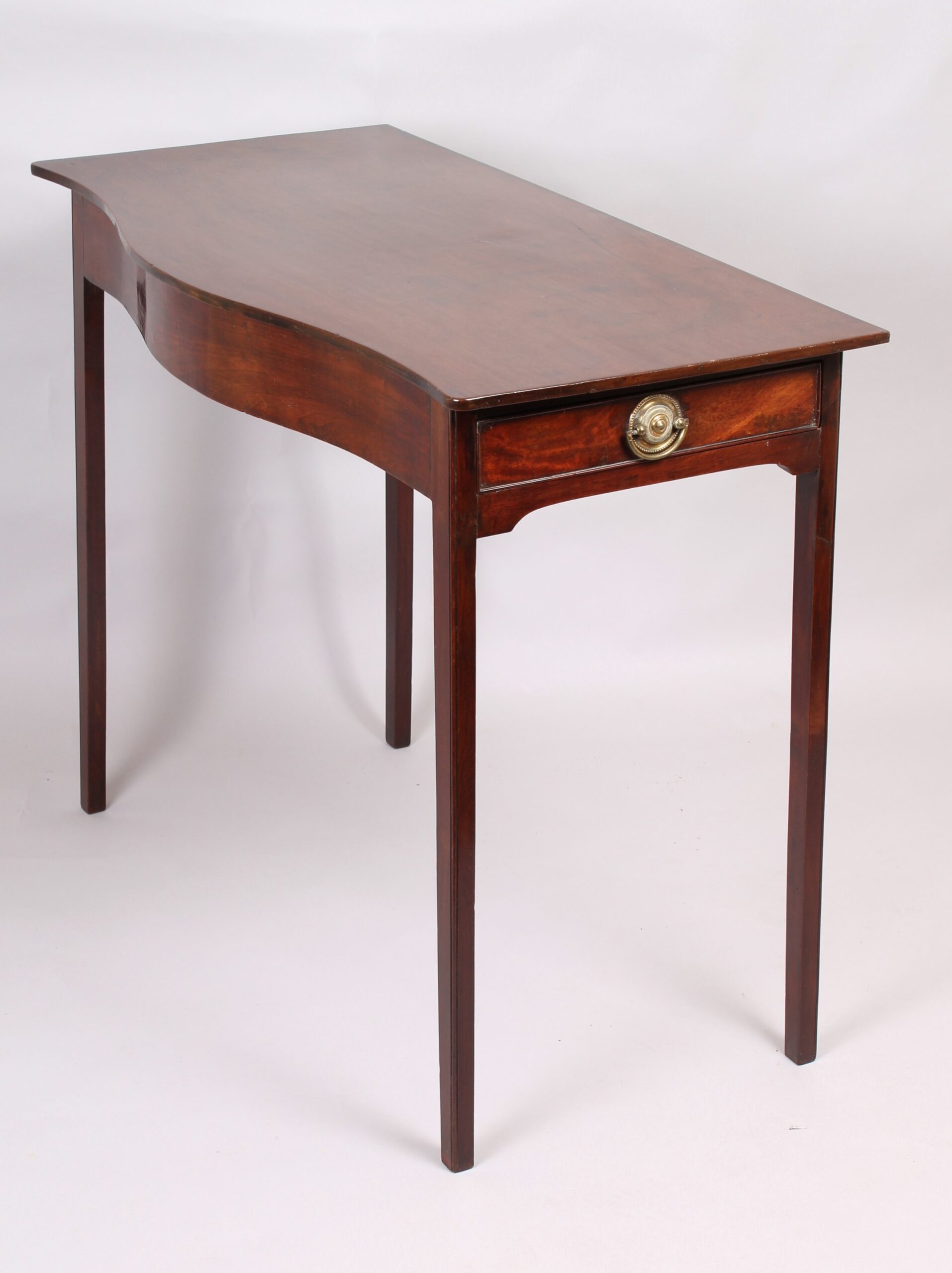 George III period mahogany side-table of simple serpentine form