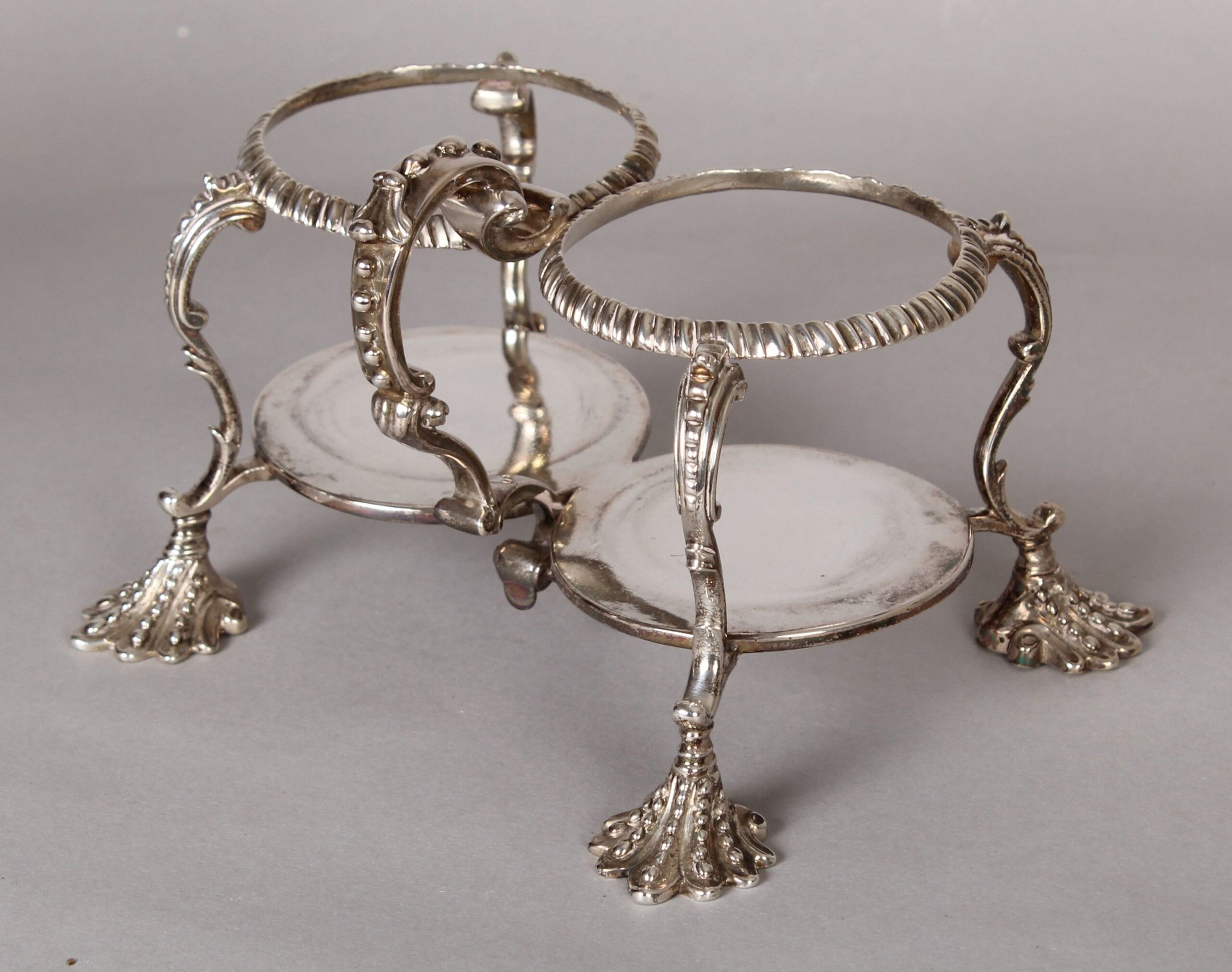George II silver oil and vinegar cruet with original cut-glass bottles