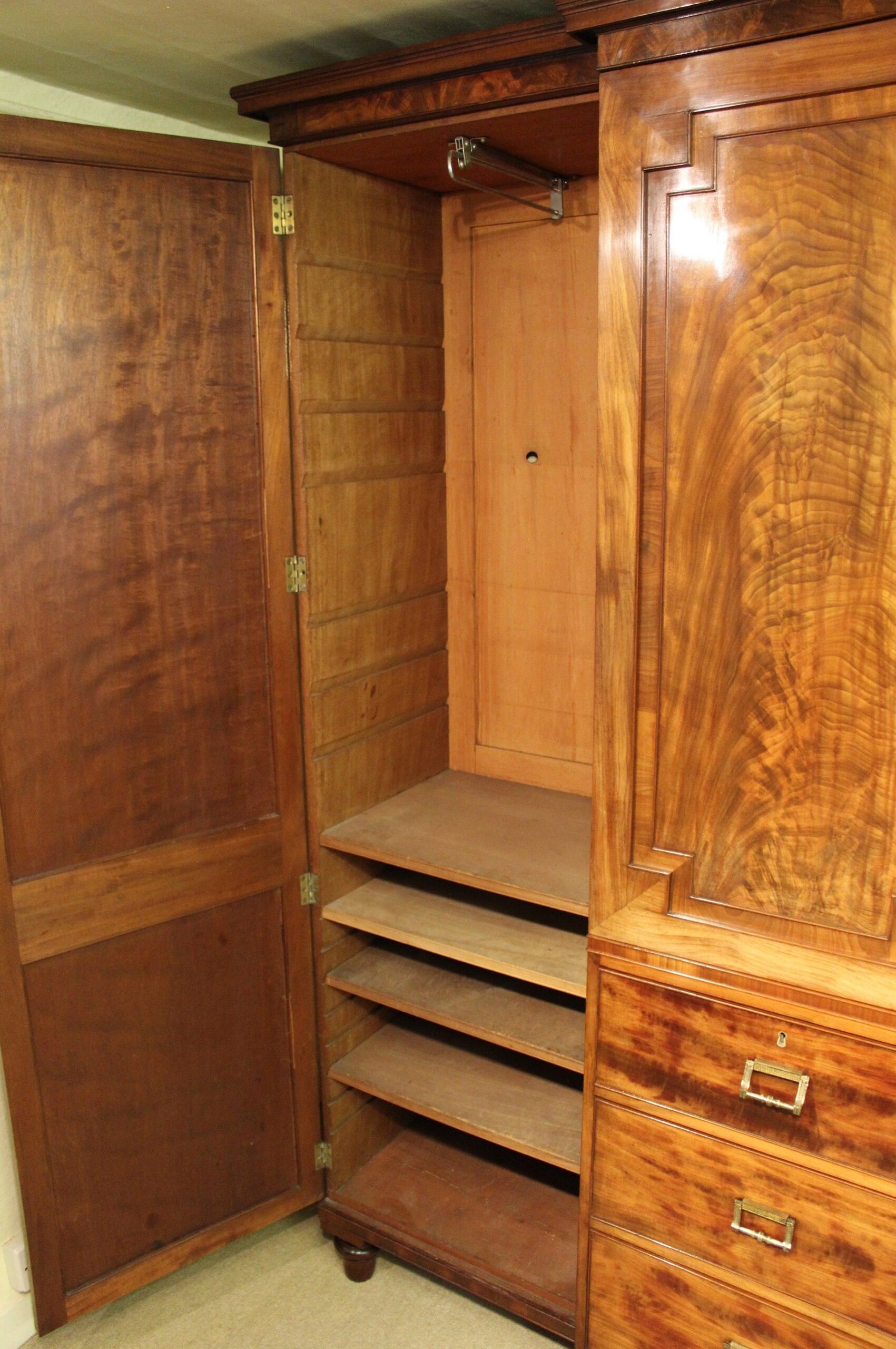 George IV period mahogany breakfront wardrobe of exceptionally fine figure and colour