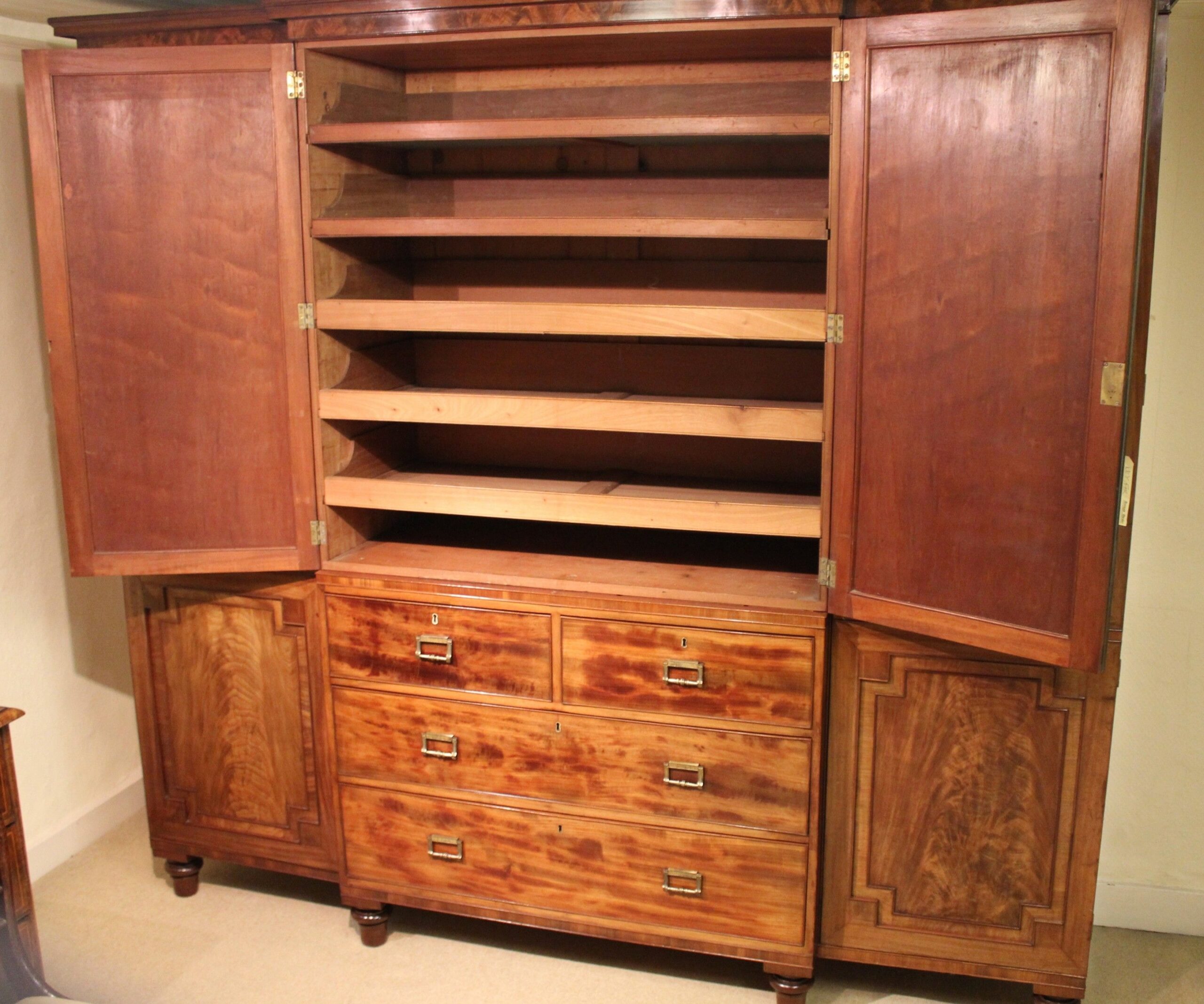 George IV period mahogany breakfront wardrobe of exceptionally fine figure and colour