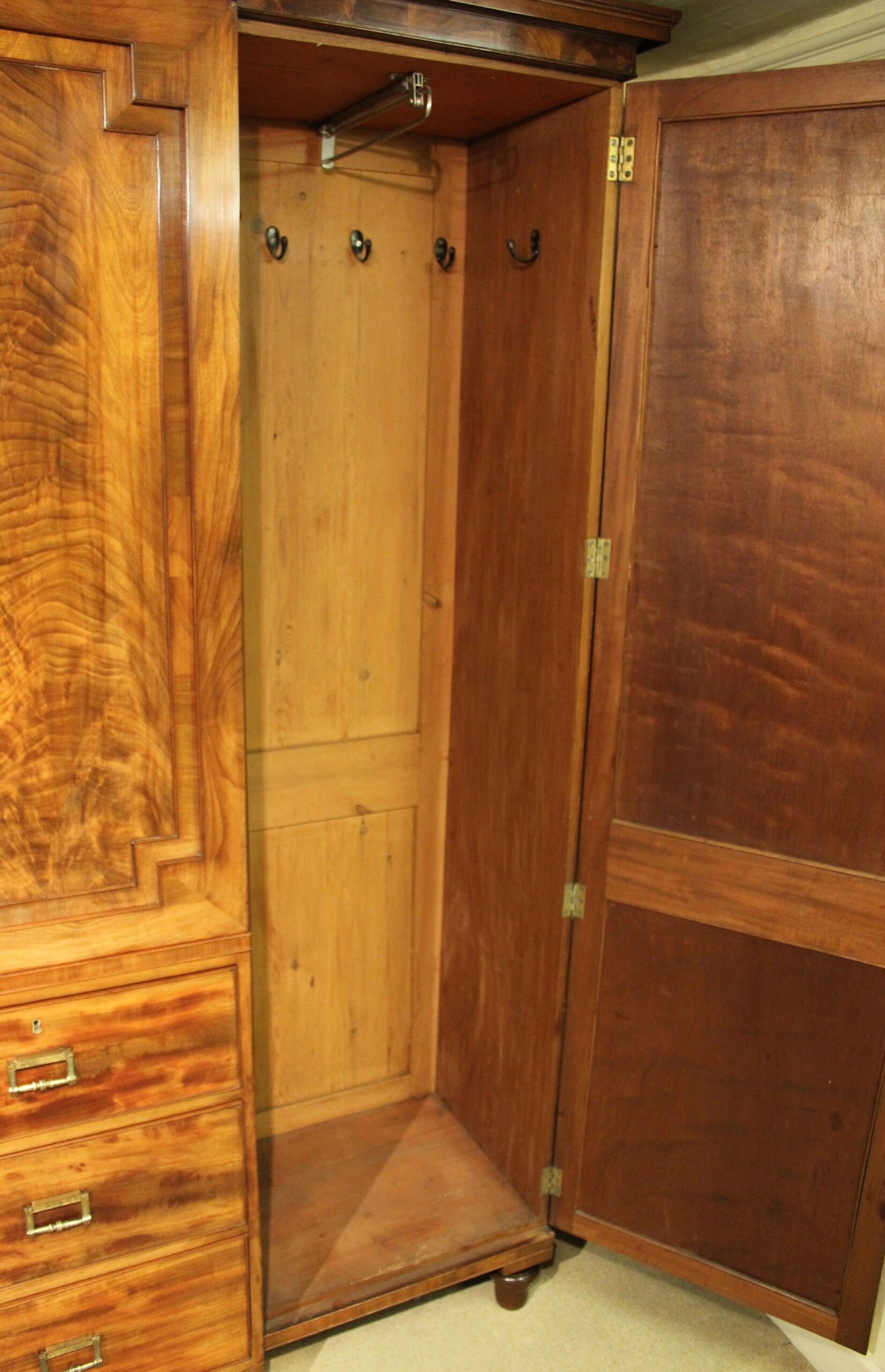 George IV period mahogany breakfront wardrobe of exceptionally fine figure and colour