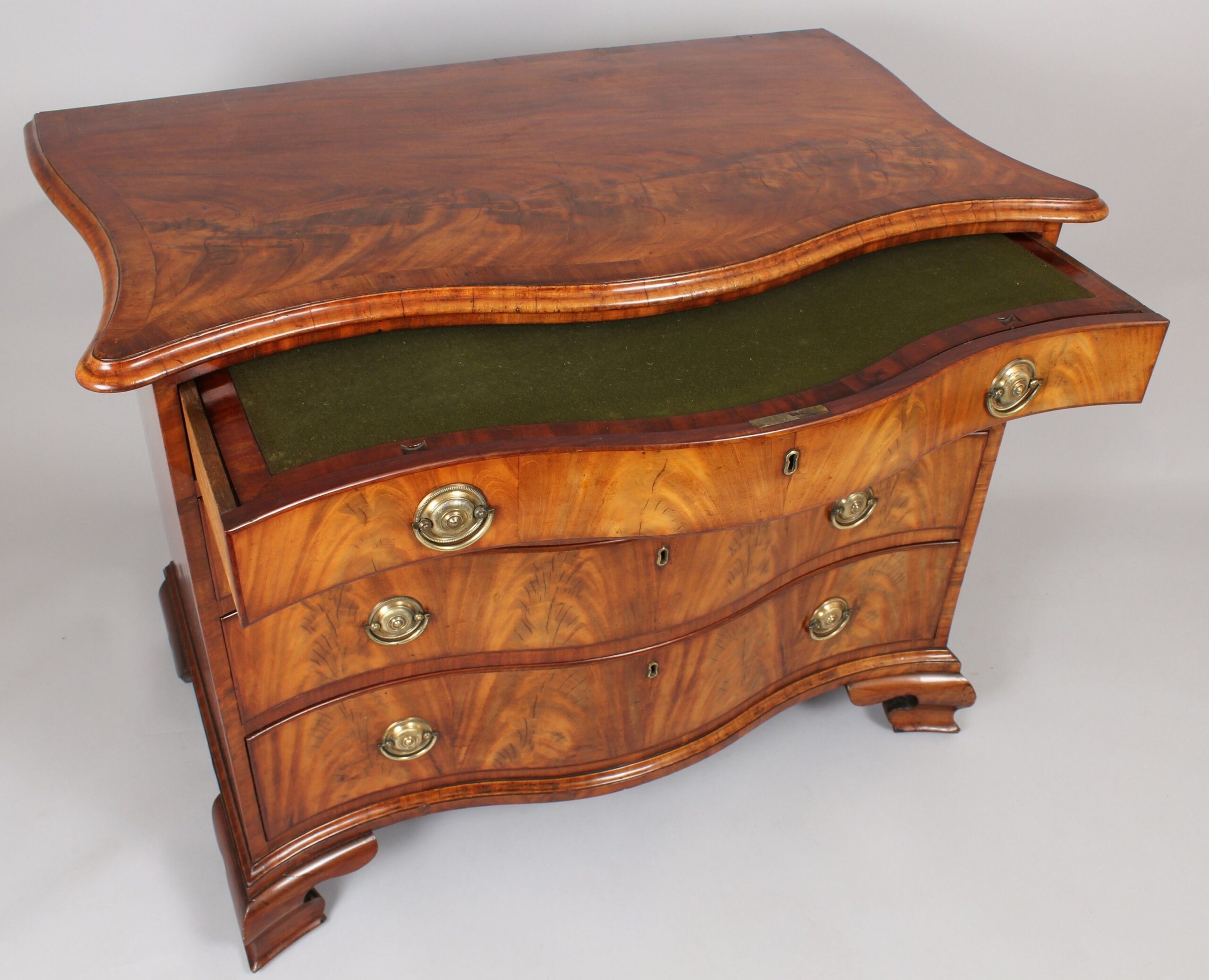 George III period mahogany serpentine-fronted chest-of-drawers