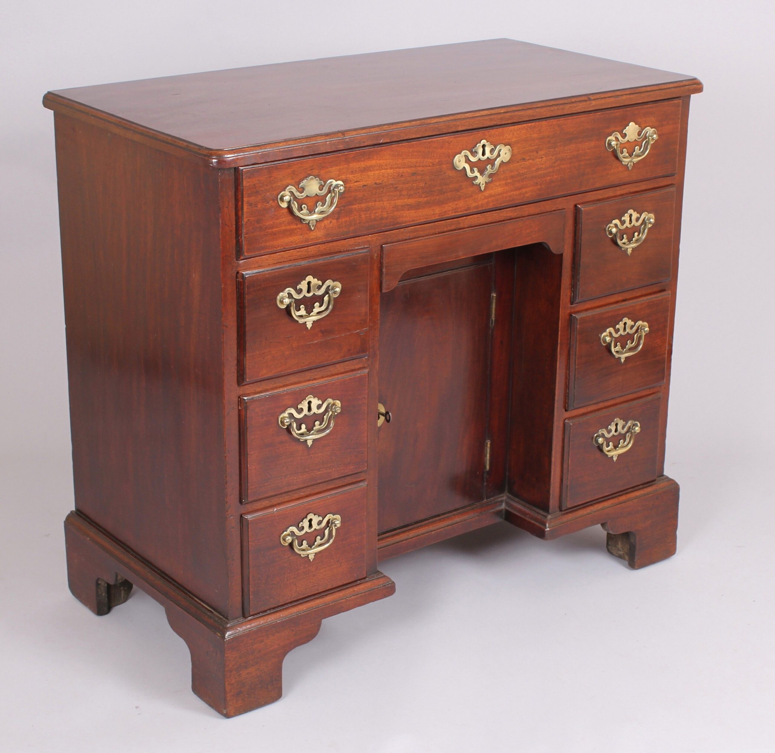 George II period mahogany kneehole dressing-table by Elizabeth Bell of London