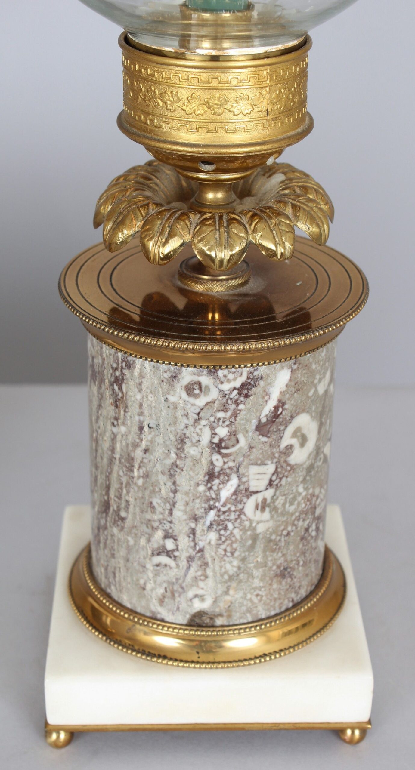 Very fine pair of early nineteenth century French ormolu and fossil marble table candlesticks with storm-shades
