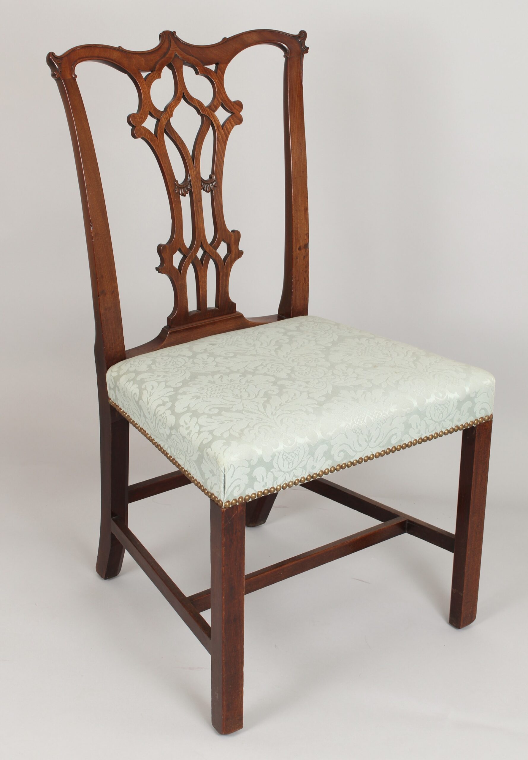 A fine pair of George III period mahogany side-chairs in the Chippendale manner