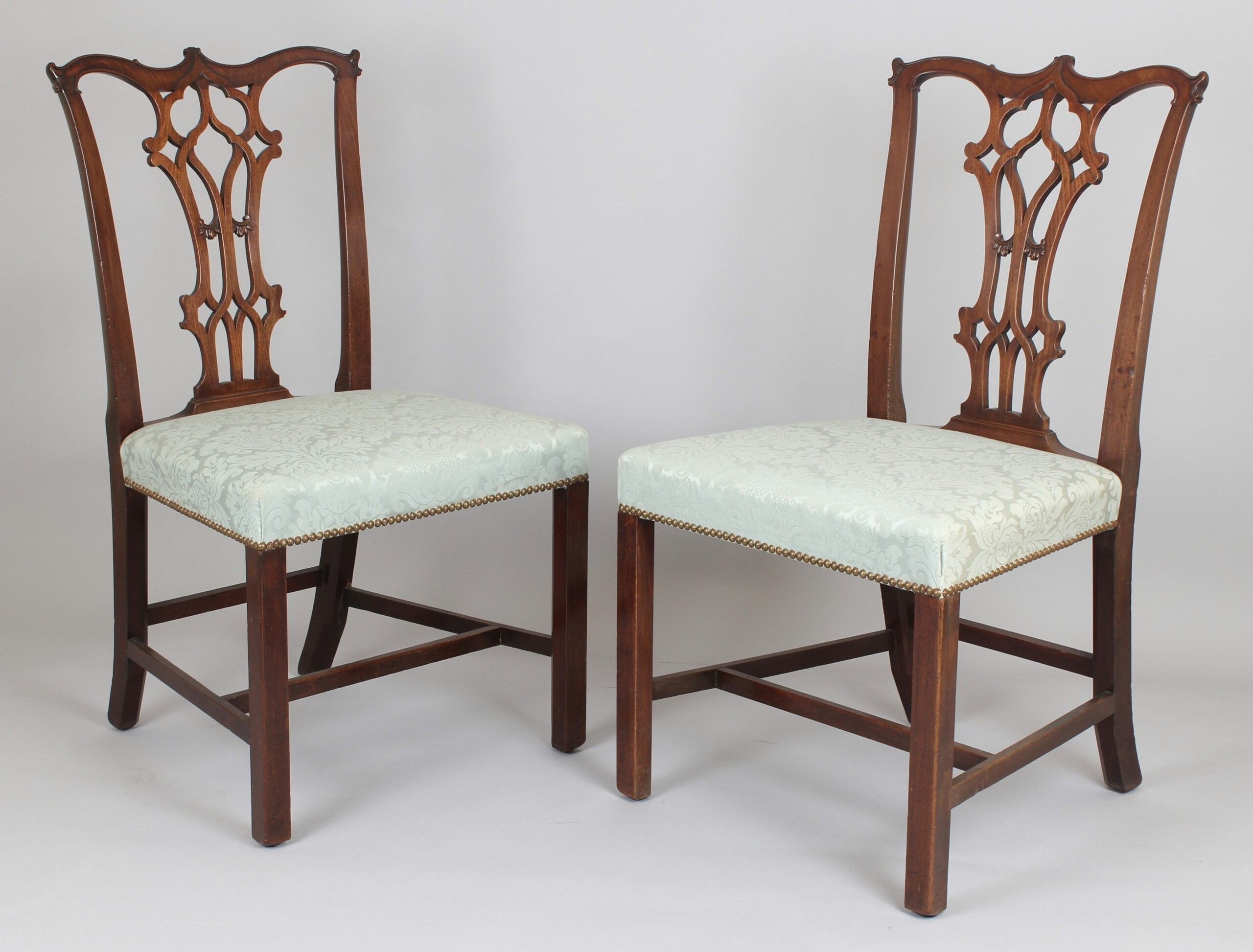A fine pair of George III period mahogany side-chairs in the Chippendale manner