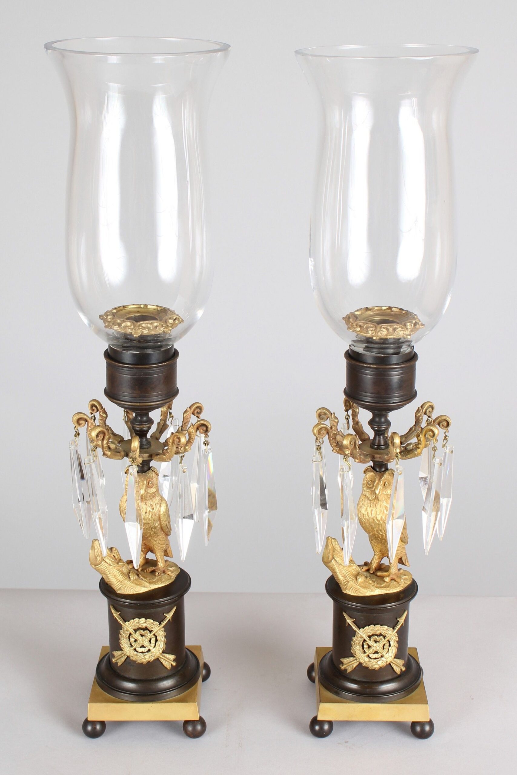 Pair of Regency period bronze and ormolu owl candlesticks/storm lights