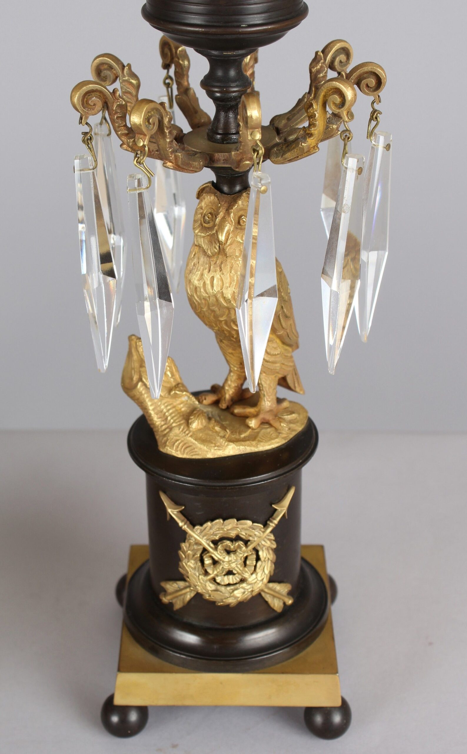 Pair of Regency period bronze and ormolu owl candlesticks/storm lights