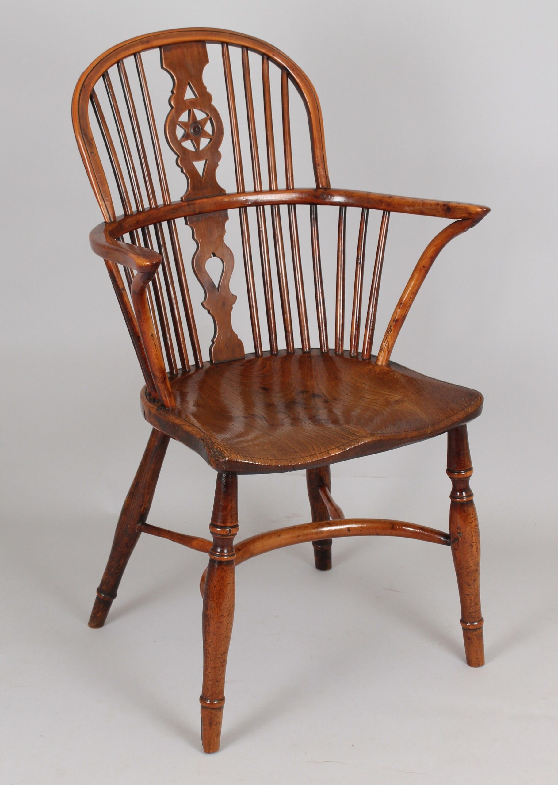 Fine Yew wood Windsor “star” back arm-chair