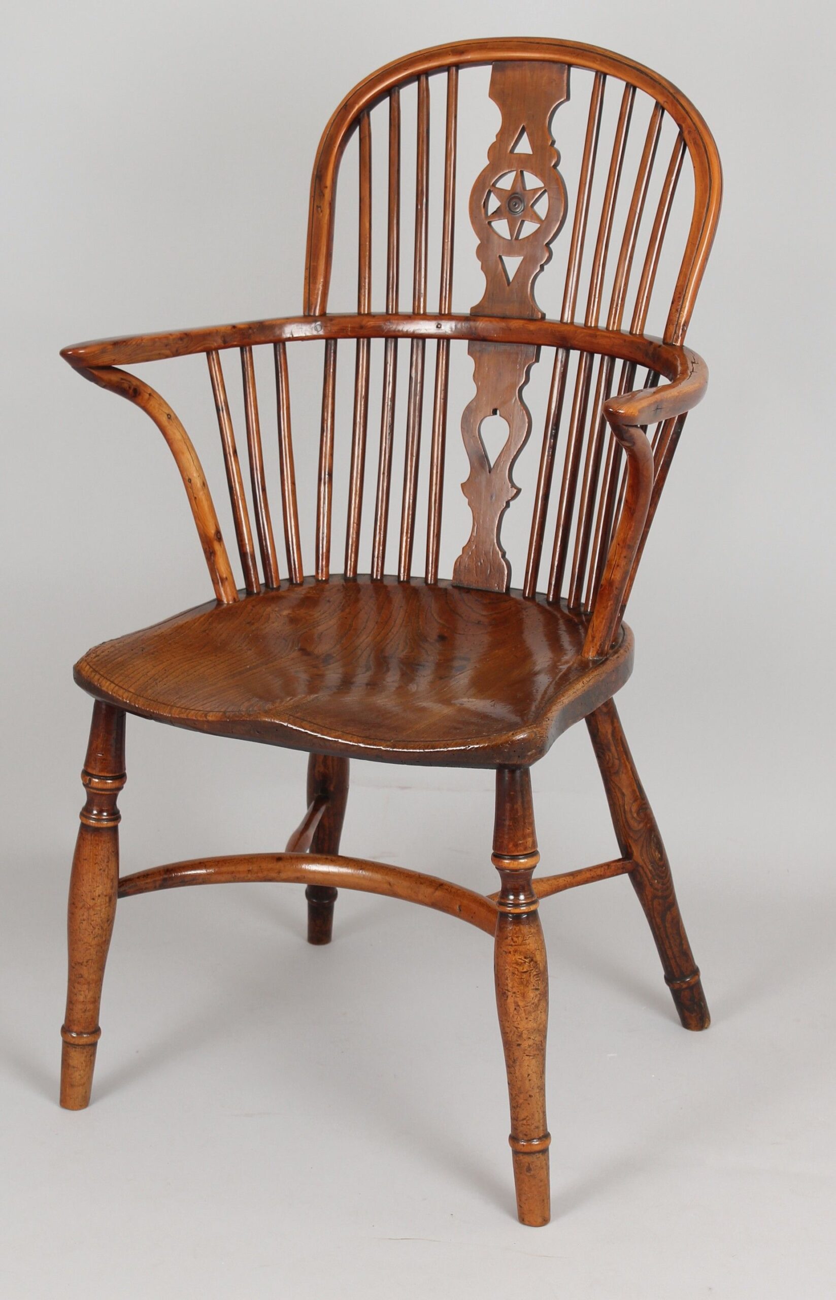 Fine Yew wood Windsor “star” back arm-chair