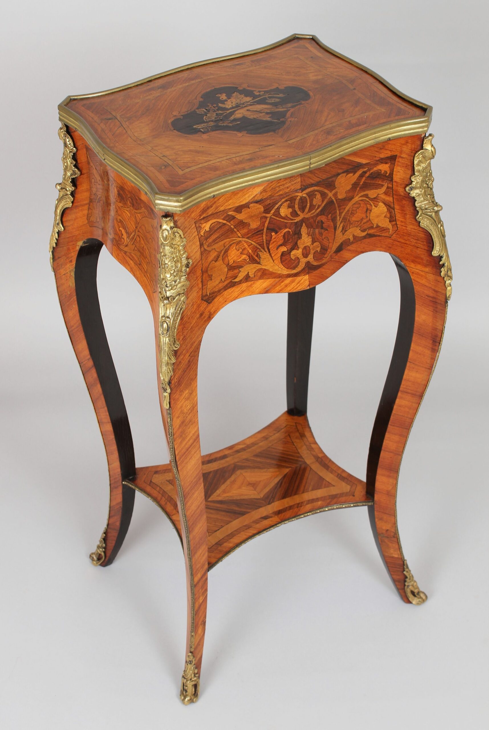 A mid nineteenth century French kingwood and marquetry table in the Louis XV manner