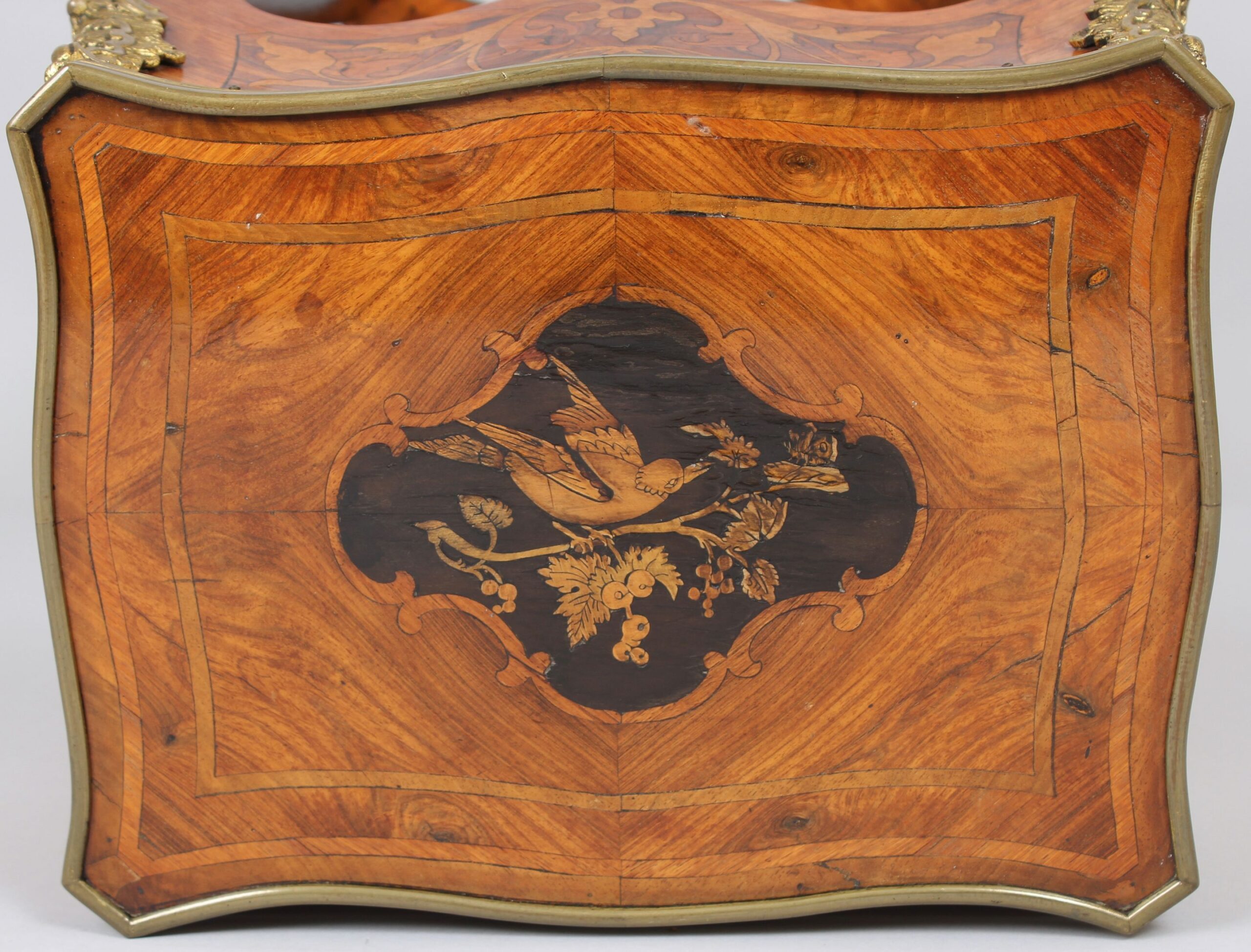 A mid nineteenth century French kingwood and marquetry table in the Louis XV manner