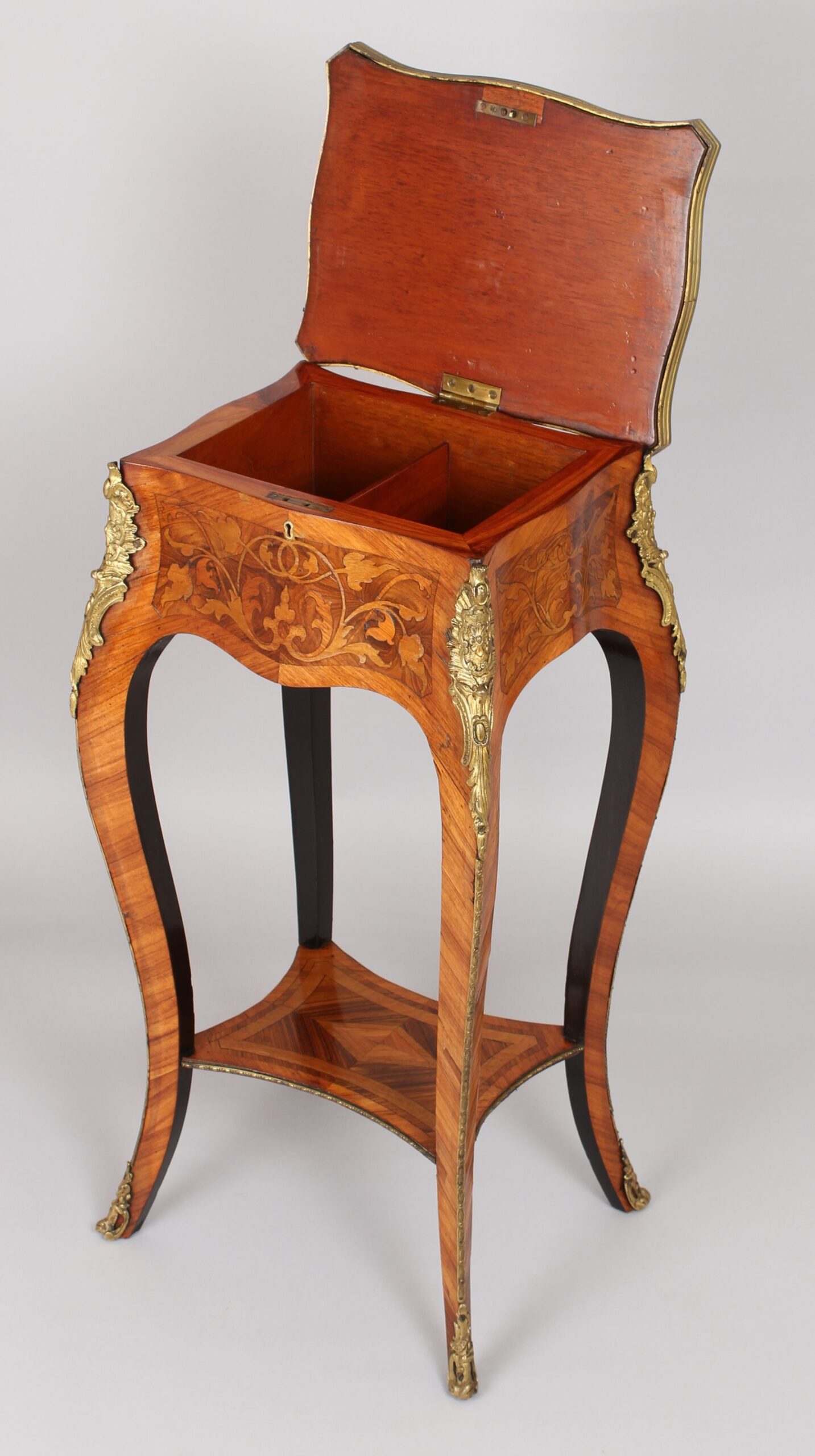A mid nineteenth century French kingwood and marquetry table in the Louis XV manner