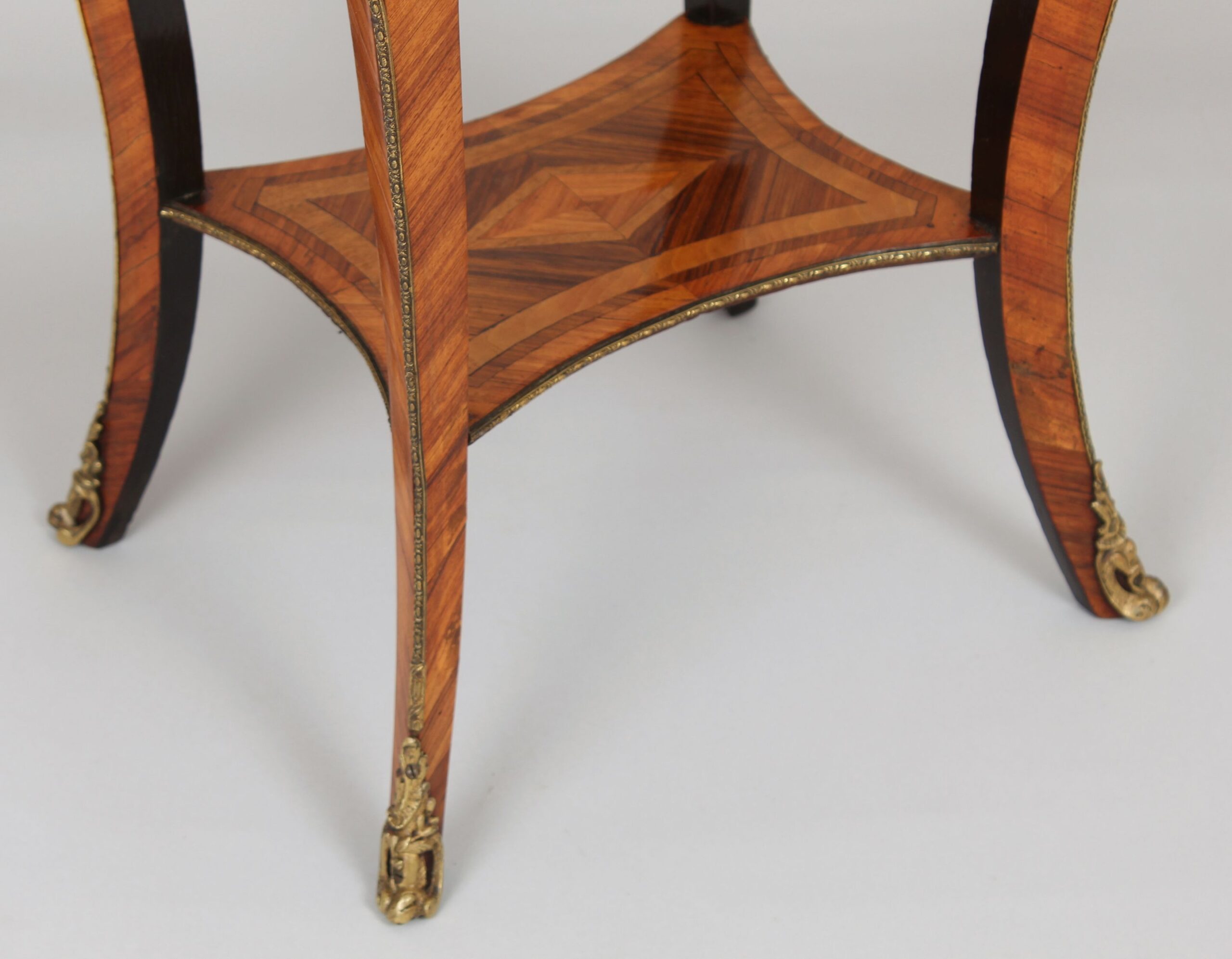 A mid nineteenth century French kingwood and marquetry table in the Louis XV manner