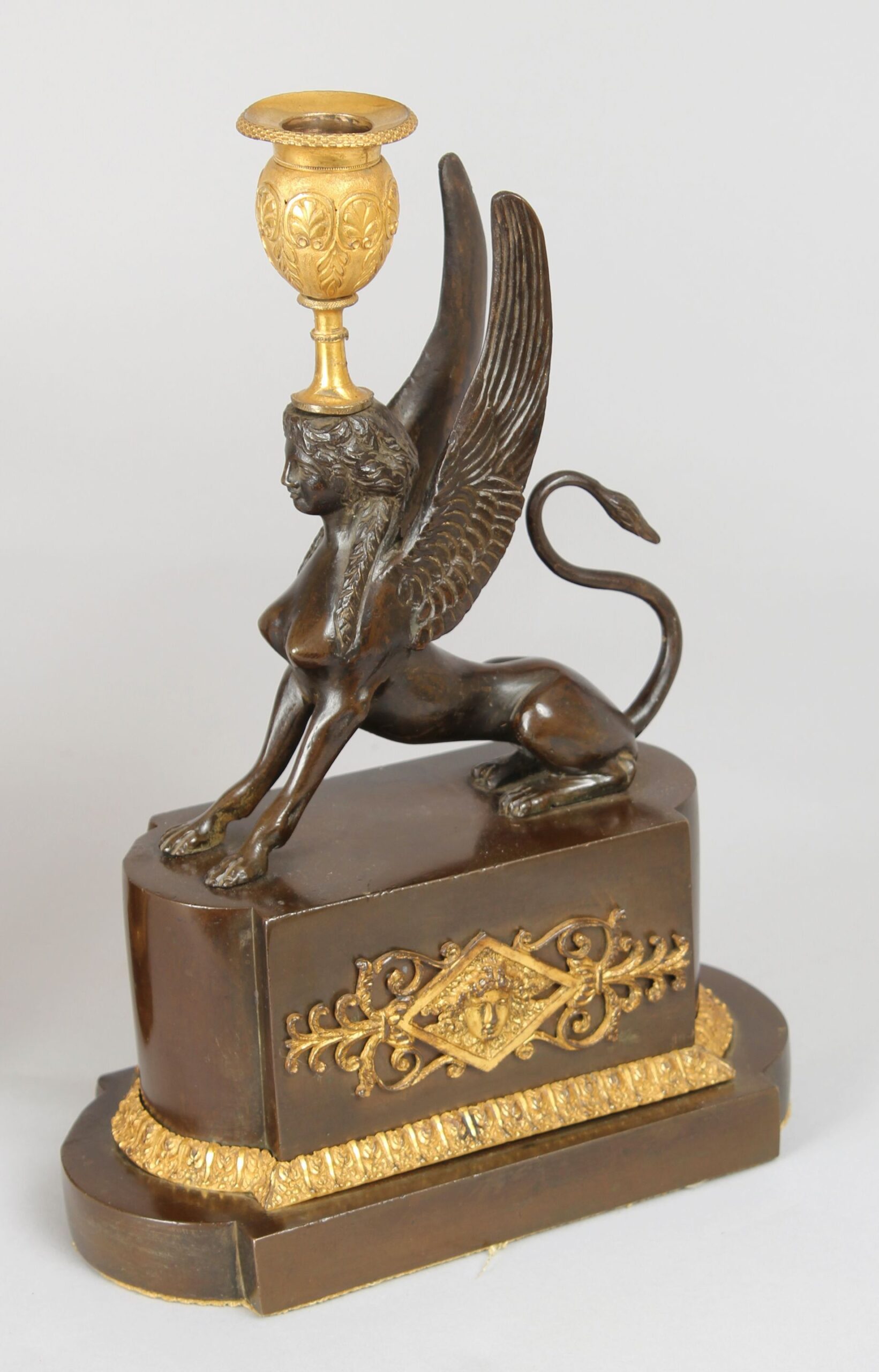 Pair of fine early nineteenth century bronze and ormolu Griffin candlesticks