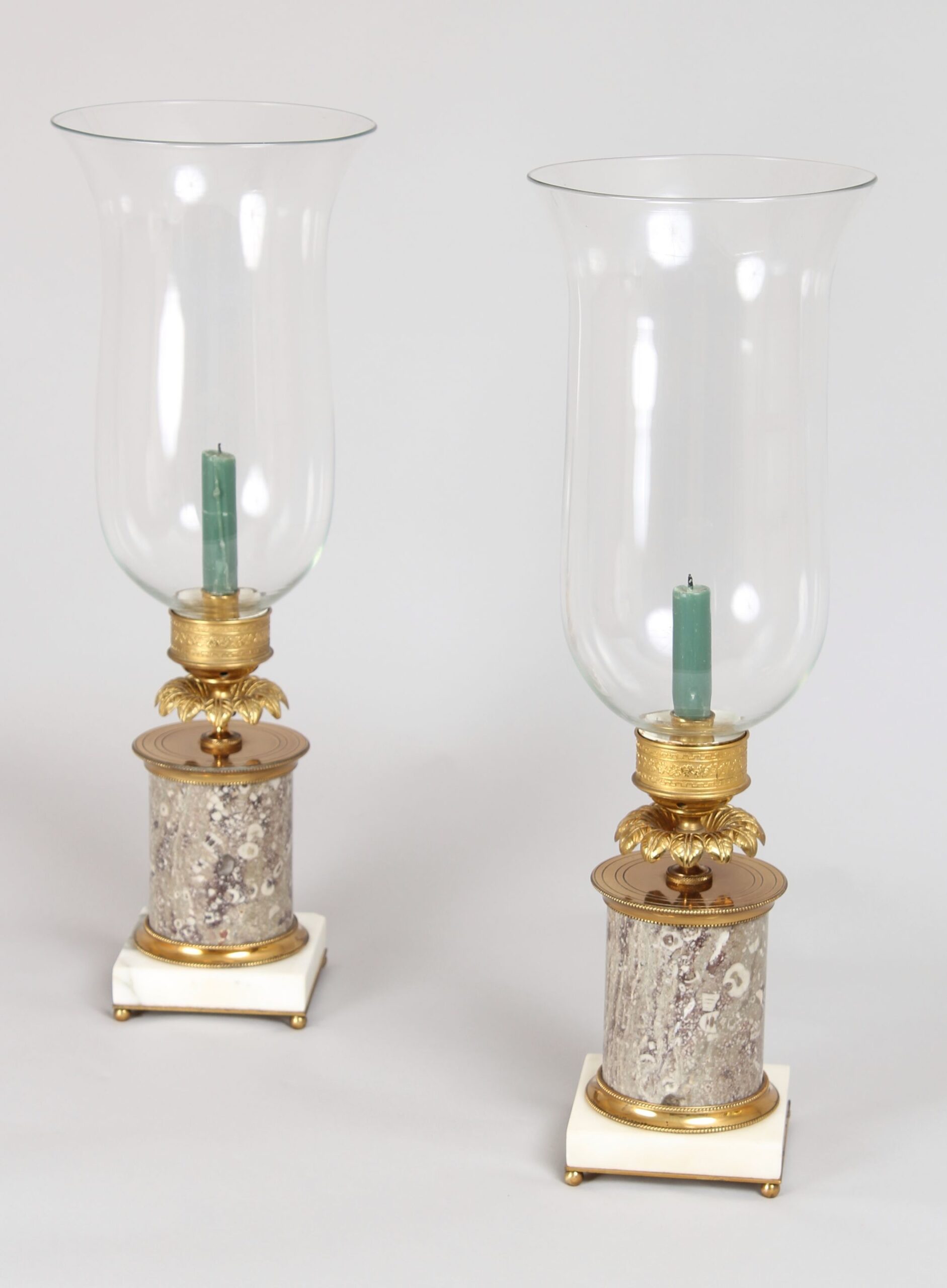 Very fine pair of early nineteenth century French ormolu and fossil marble table candlesticks with storm-shades