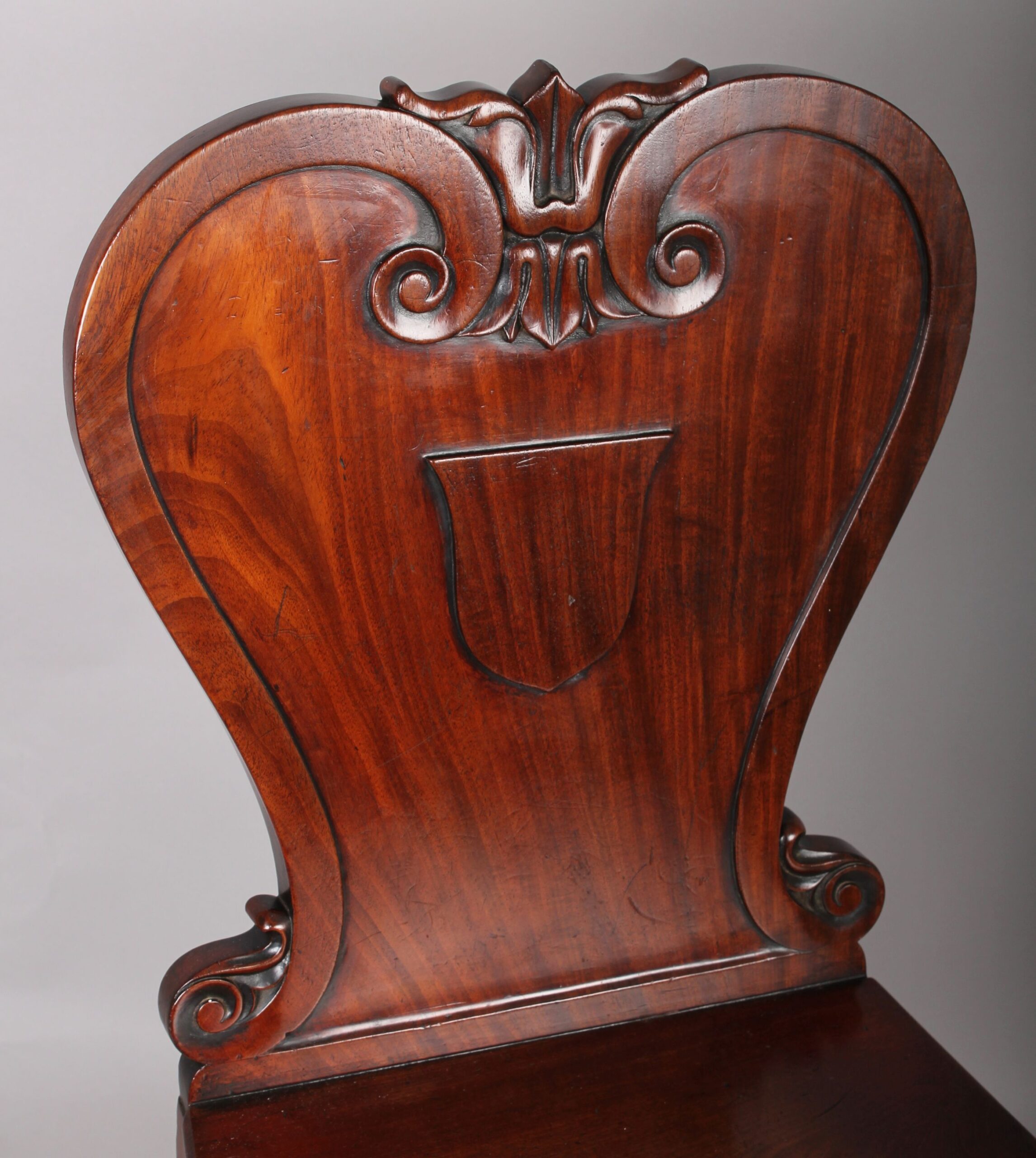 Pair of William IV period mahogany hall-chairs by Johnstone Jupe & Co., London