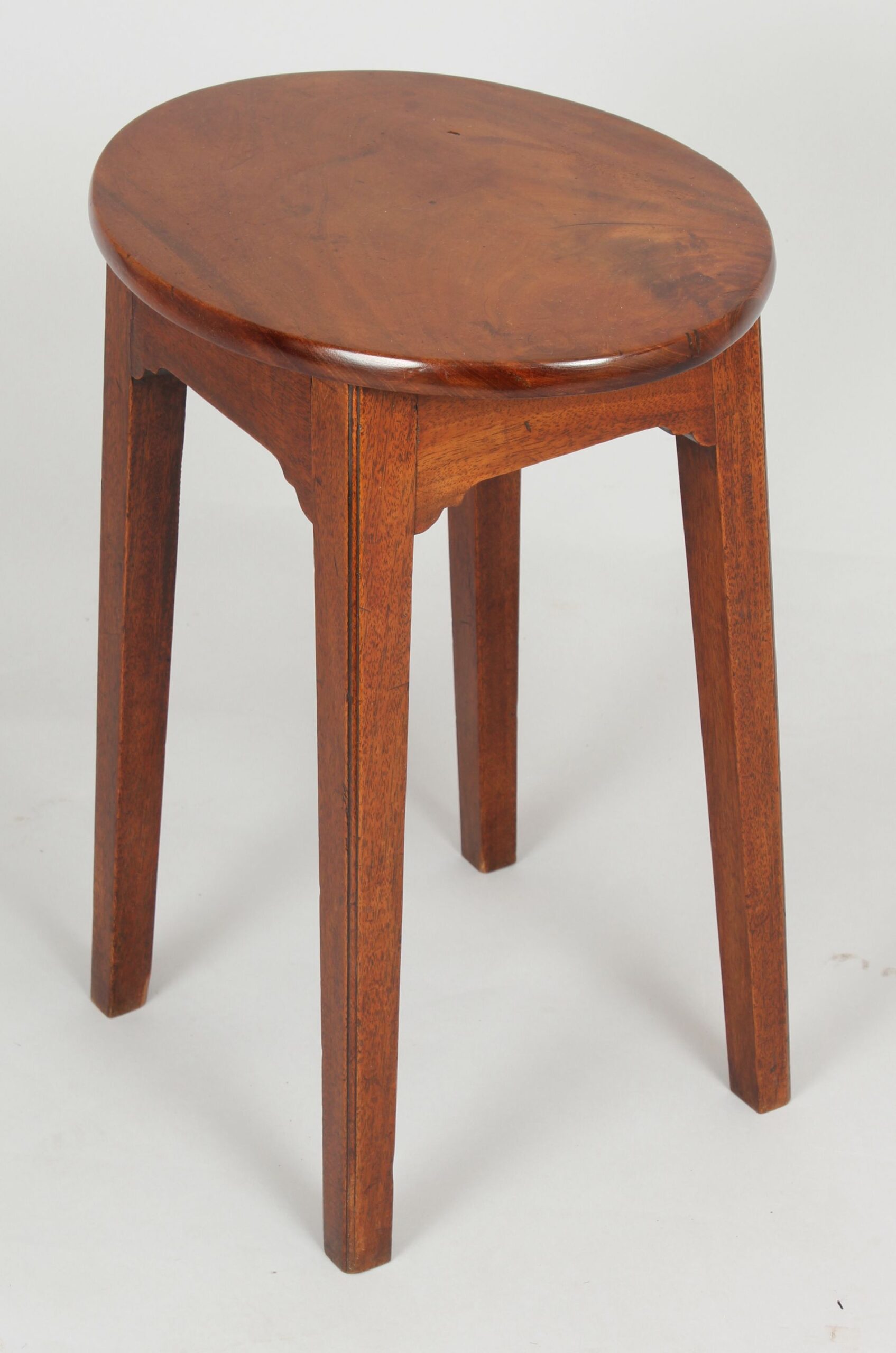 A simple George III period mahogany stool