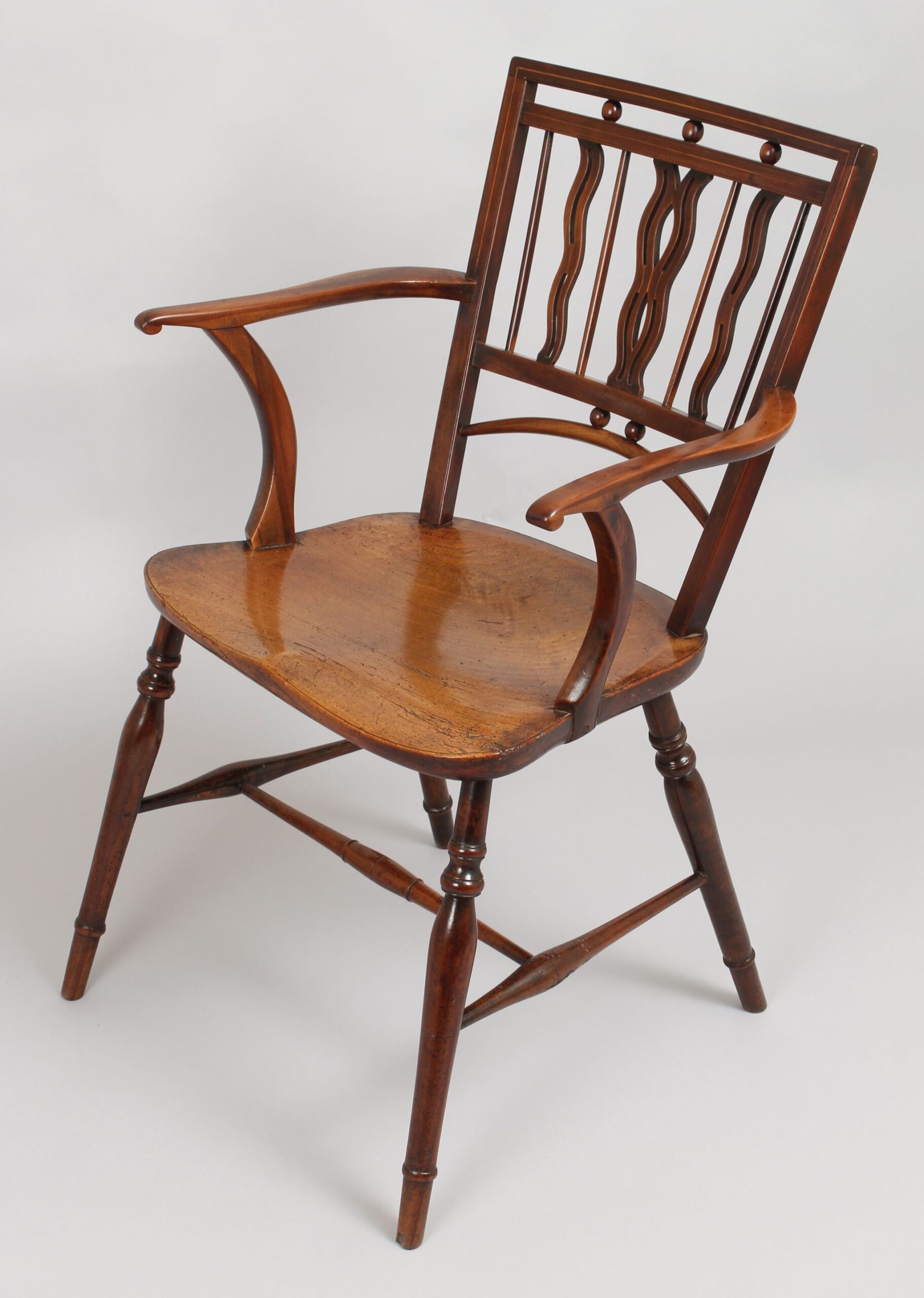 Early 19th century fruitwood Mendlesham Windsor arm-chair