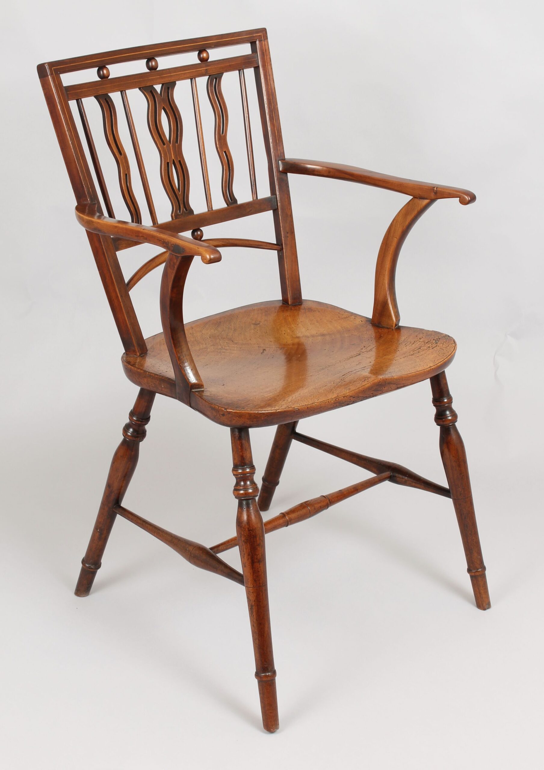 Early 19th century fruitwood Mendlesham Windsor arm-chair