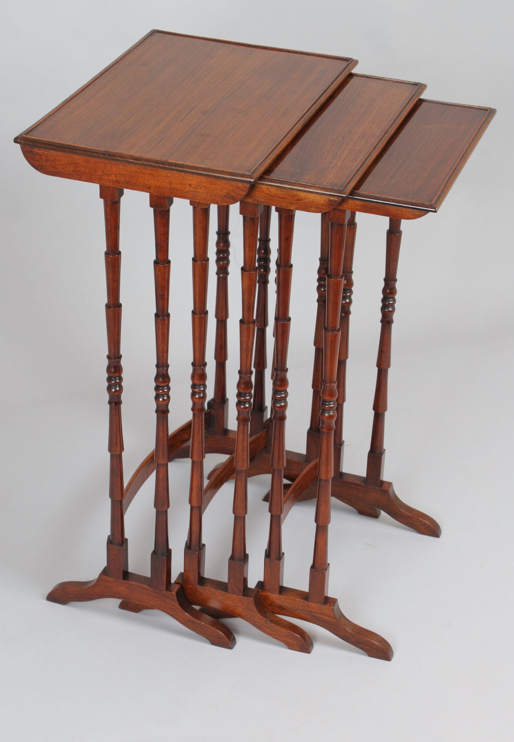 Nest of three tables in rosewood