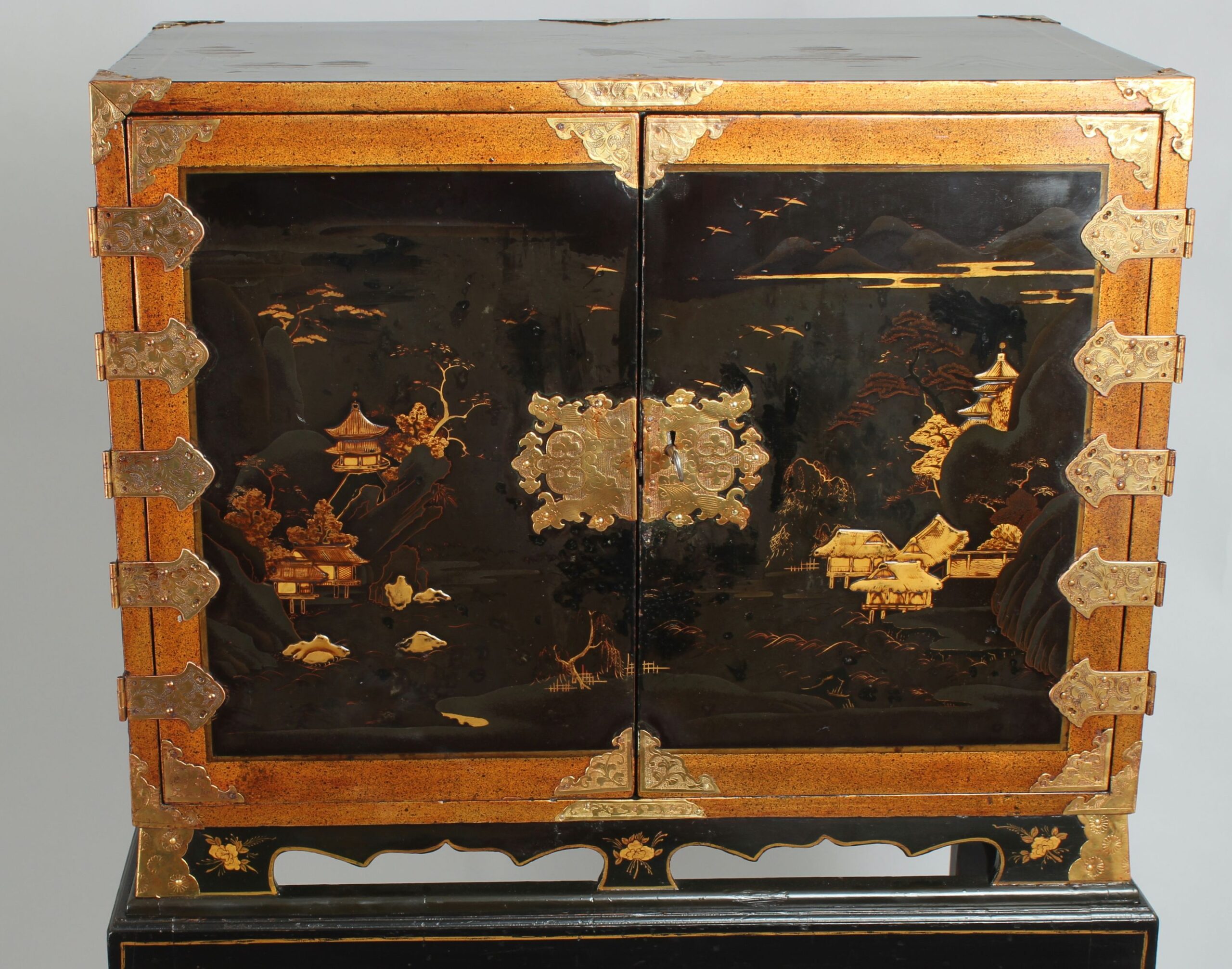 An eighteenth/nineteenth century Japanese lacquered table cabinet