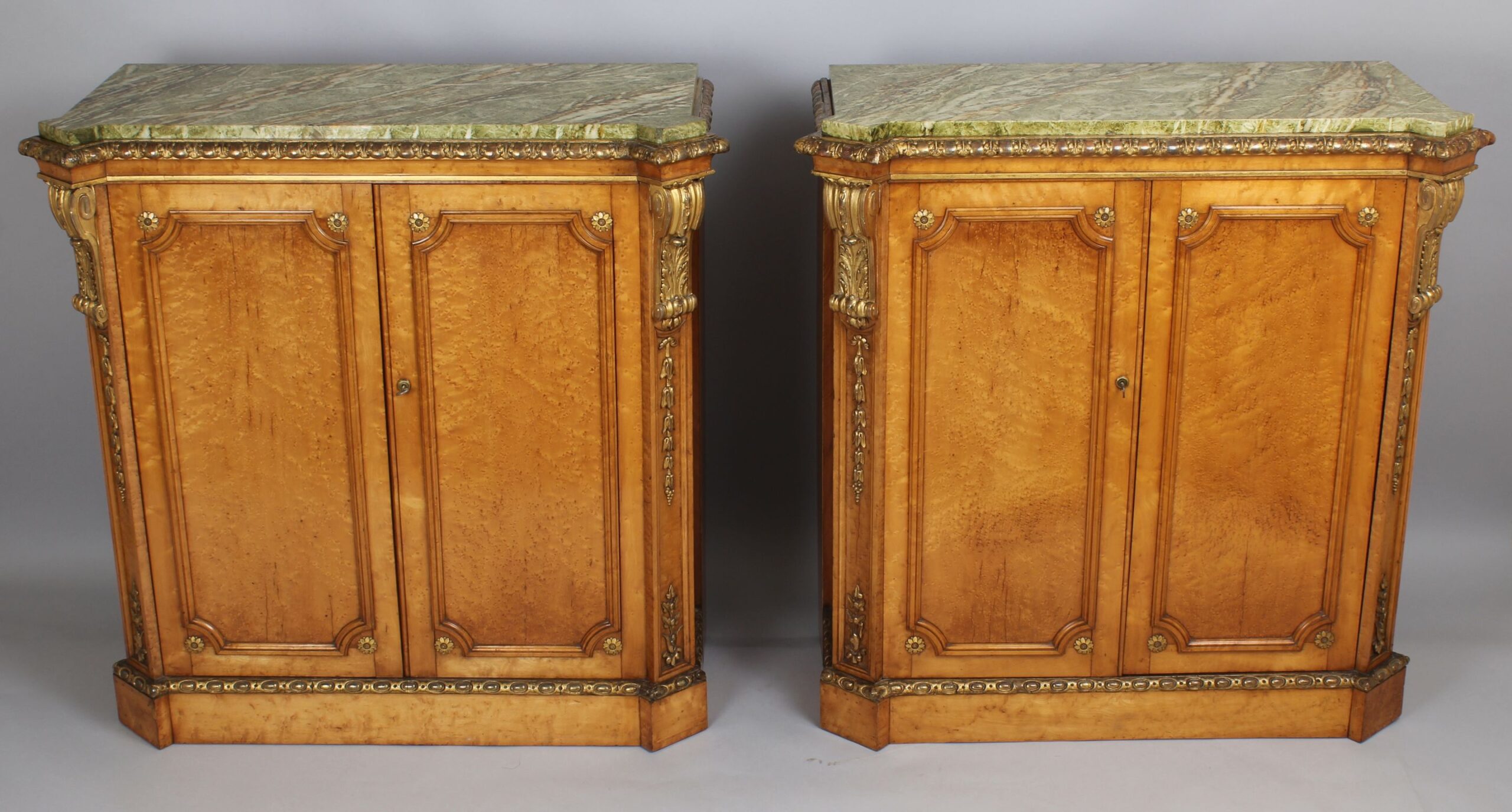 Fine pair side-cabinets in the manner of Holland & Sons