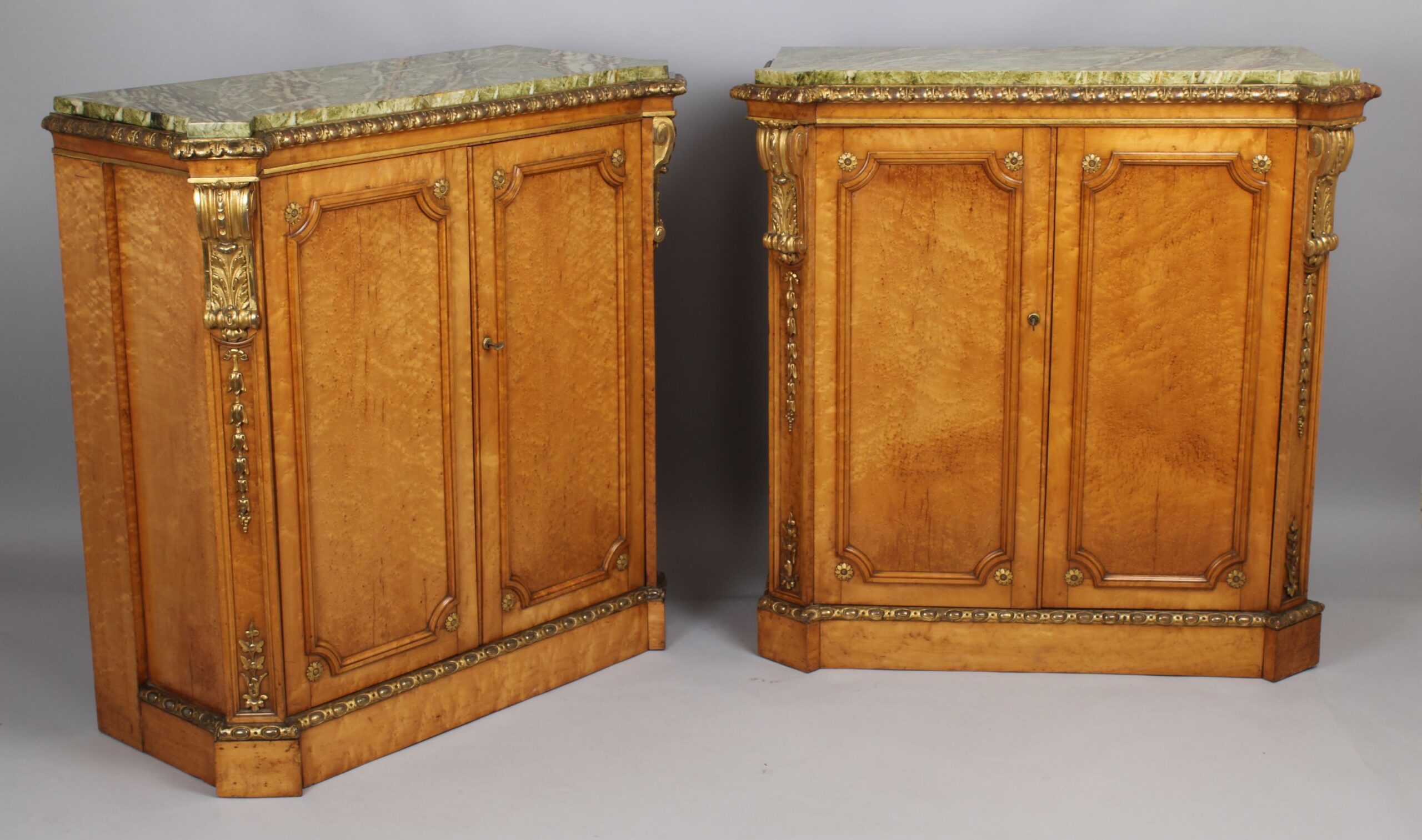 Fine pair side-cabinets in the manner of Holland & Sons