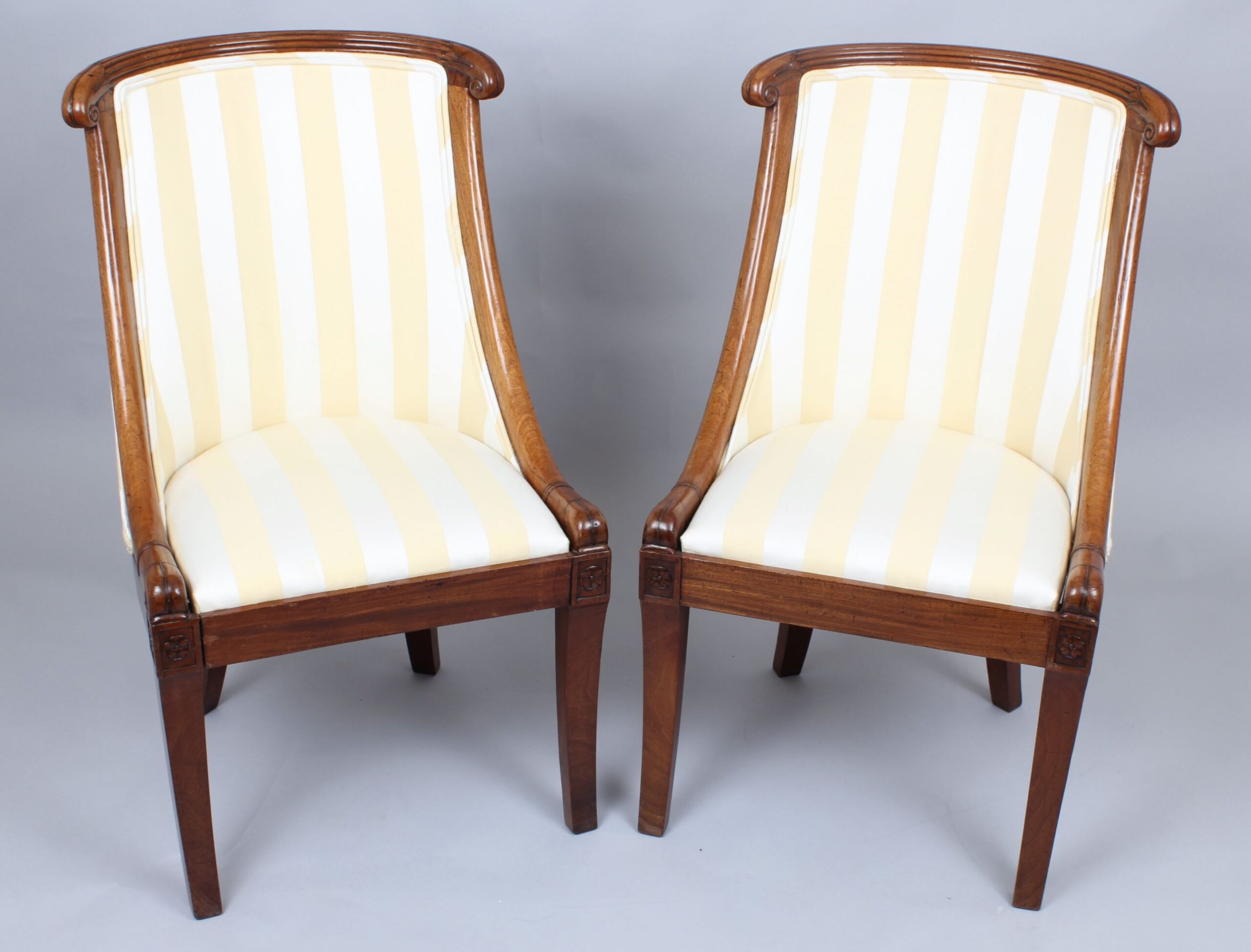 Pair of early 19th century French mahogany small bergeres