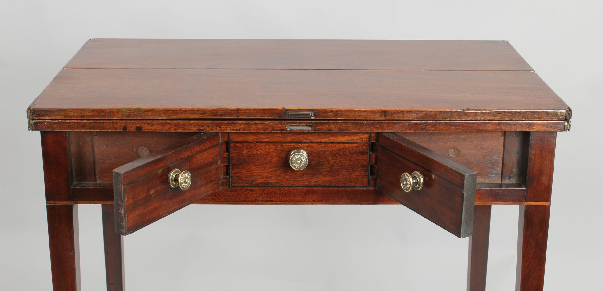 Unusual George III period mahogany flap-top ‘patience’ occasional-table