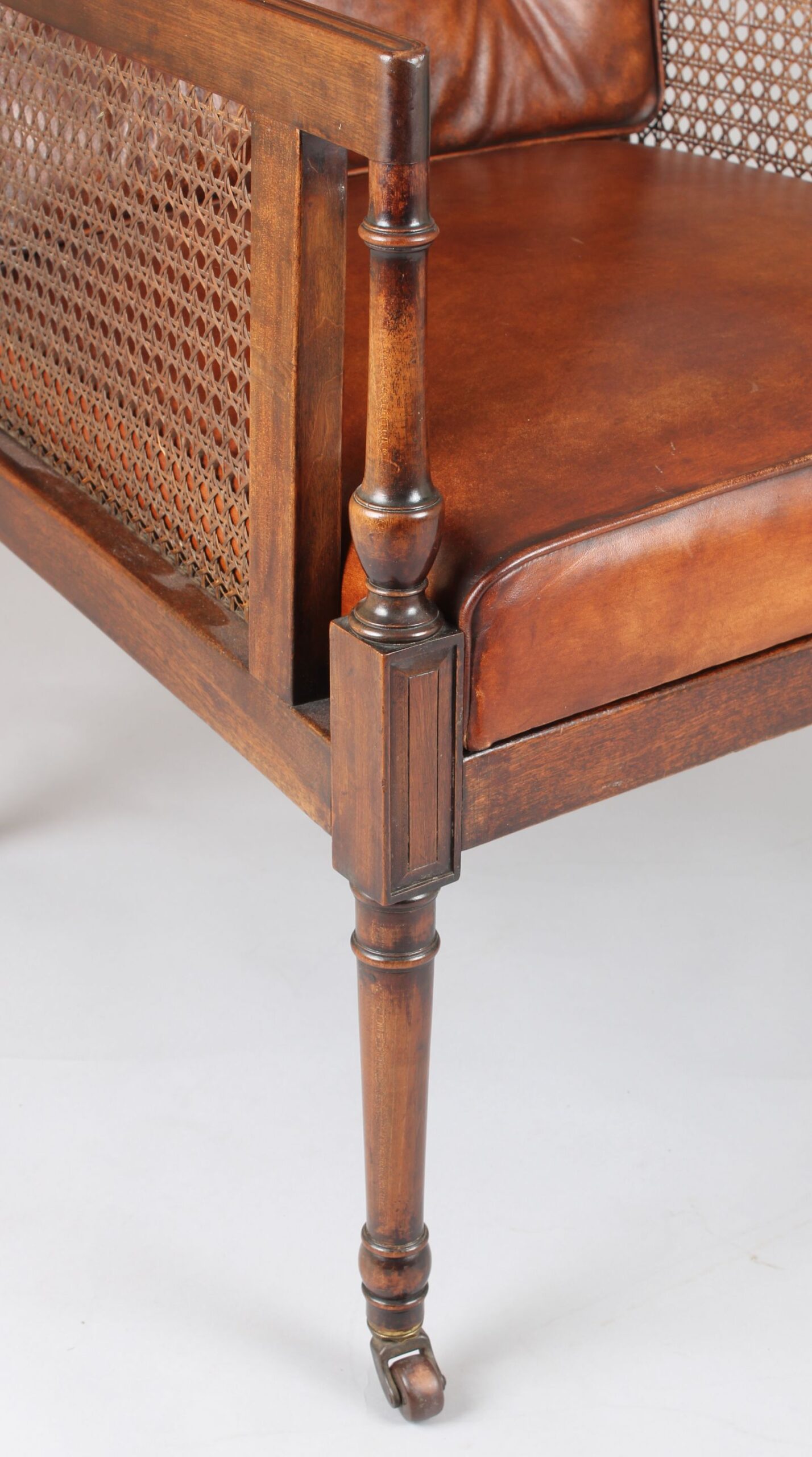 Late nineteenth century mahogany library bergere in the Regency style