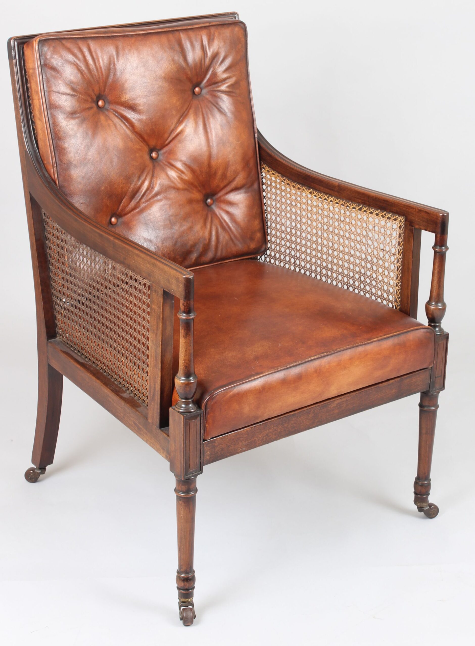 Late nineteenth century mahogany library bergere in the Regency style