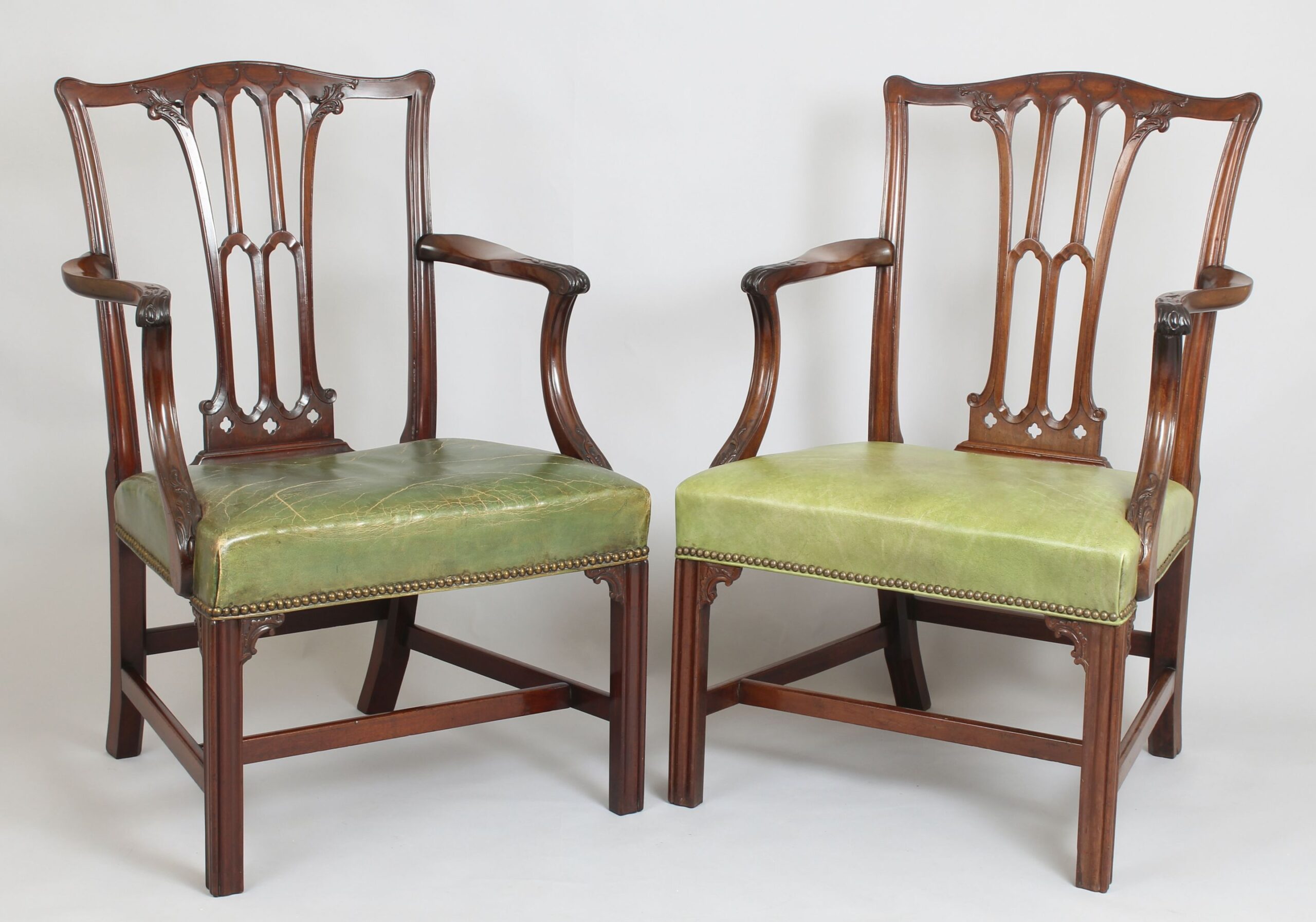 Pair of fine quality George III period mahogany elbow-chairs in the Chippendale manner