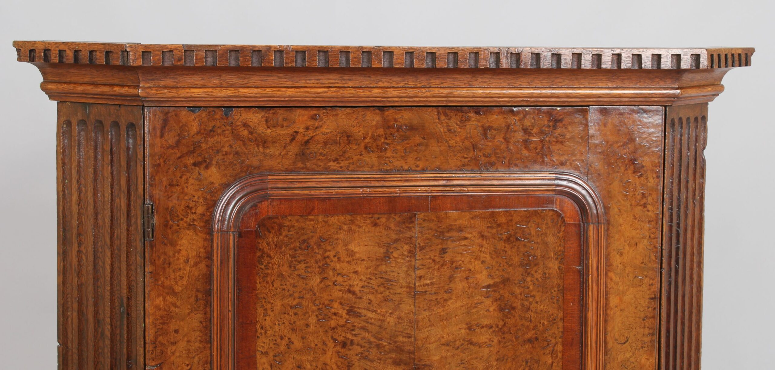 Early George III period burr oak corner cupboard