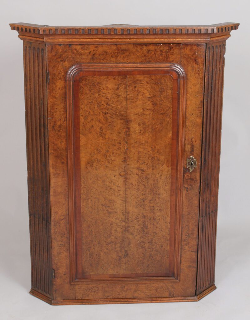 Early George III period burr oak corner cupboard