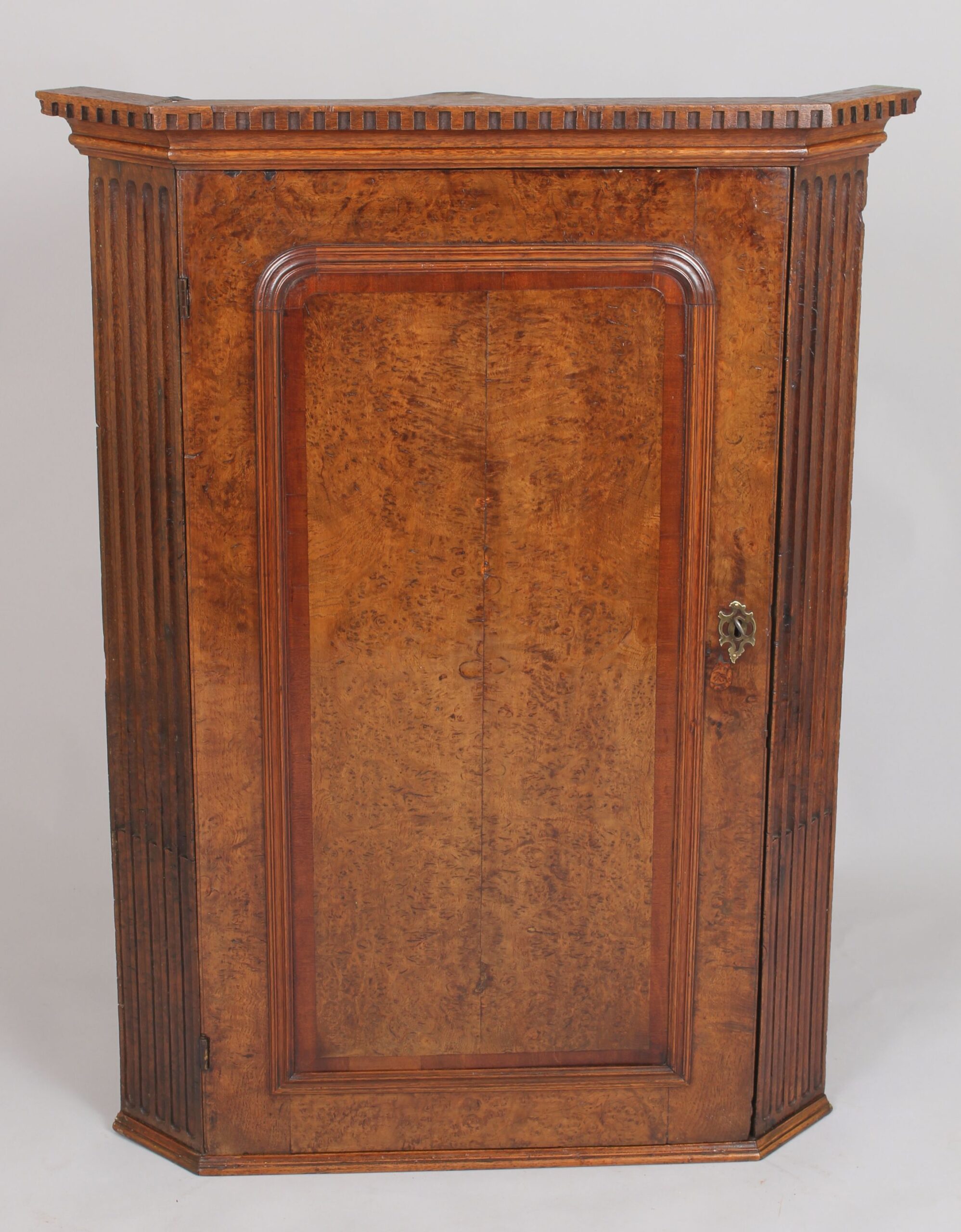 Early George III period burr oak corner cupboard