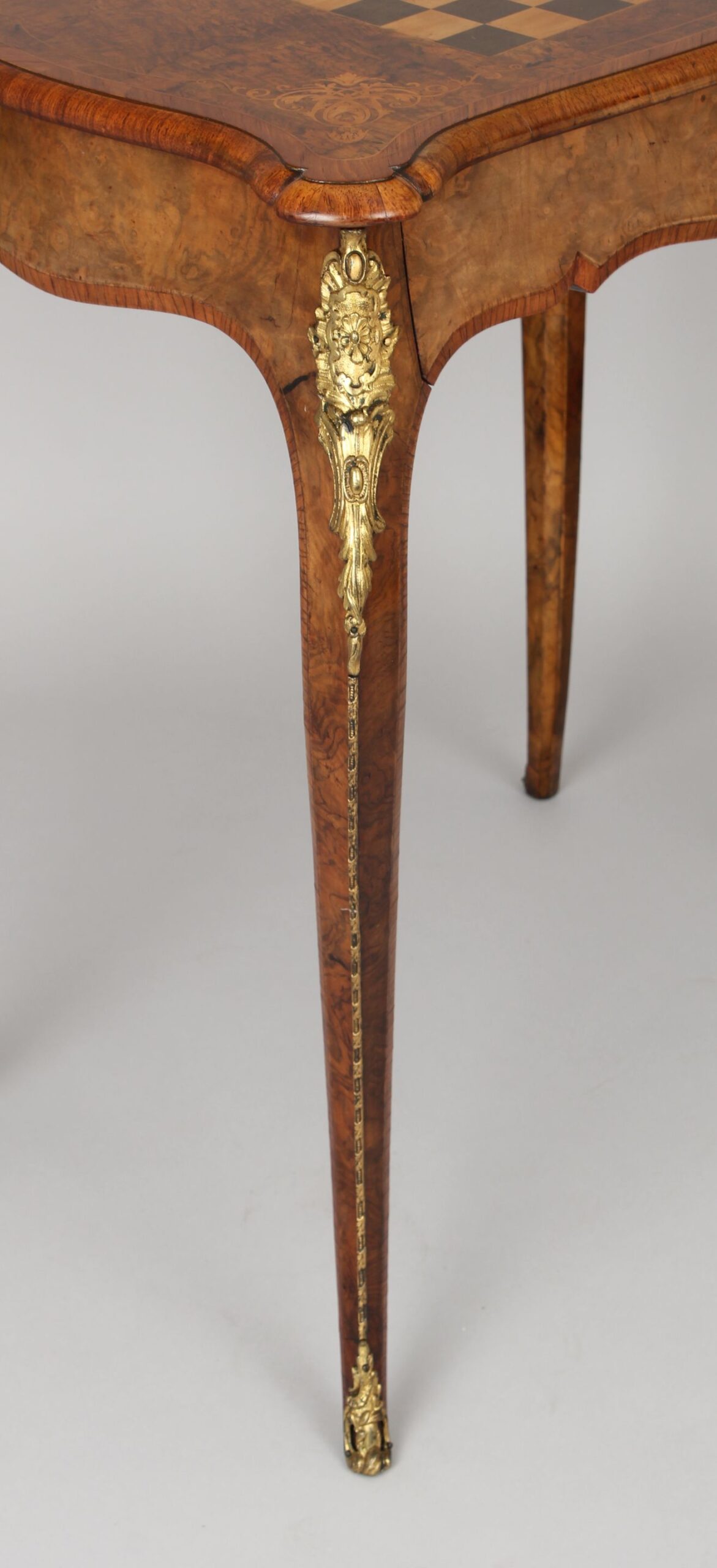 Fine quality walnut and ormolu-mounted inlaid games-table in the Louis XV revival style