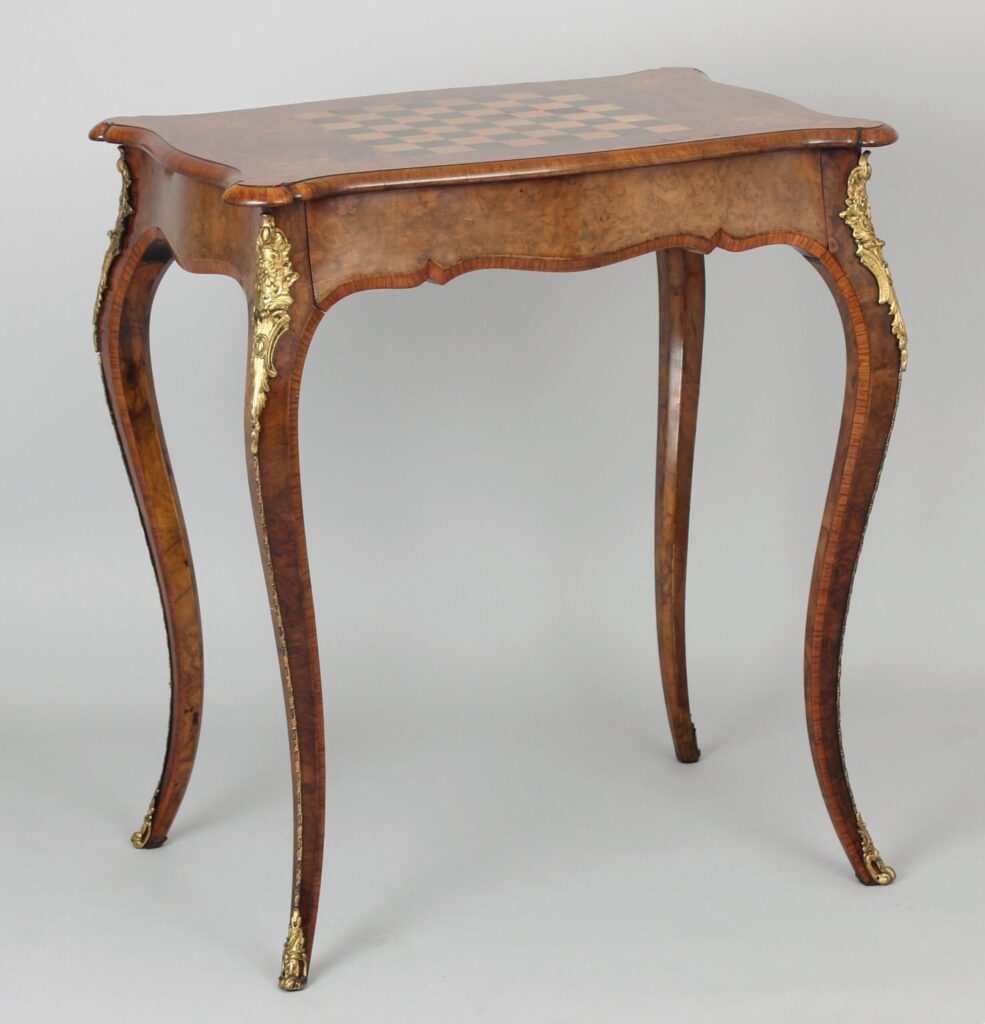 Fine quality walnut and ormolu-mounted inlaid games-table in the Louis XV revival style