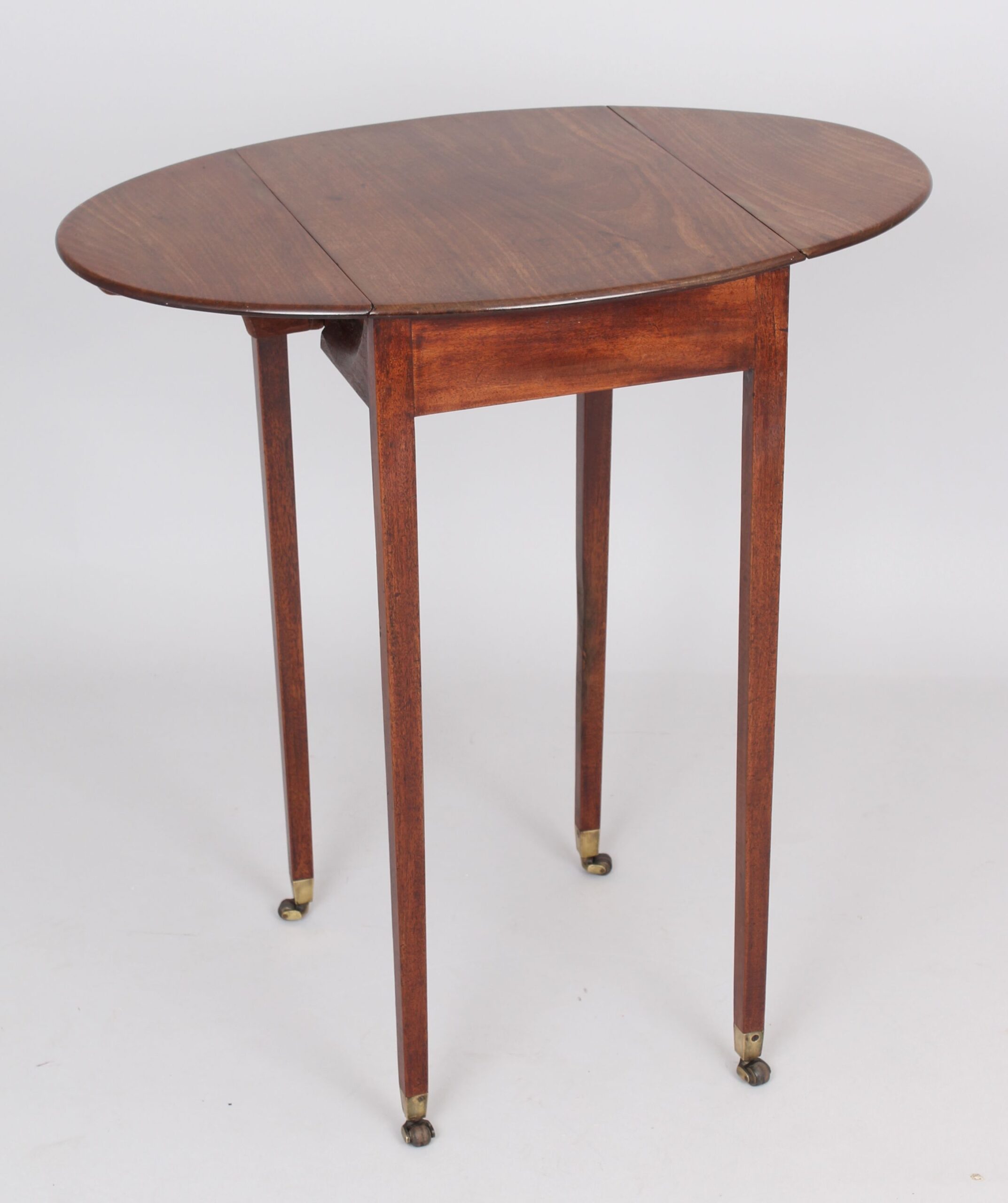 A George III period mahogany small oval Pembroke table