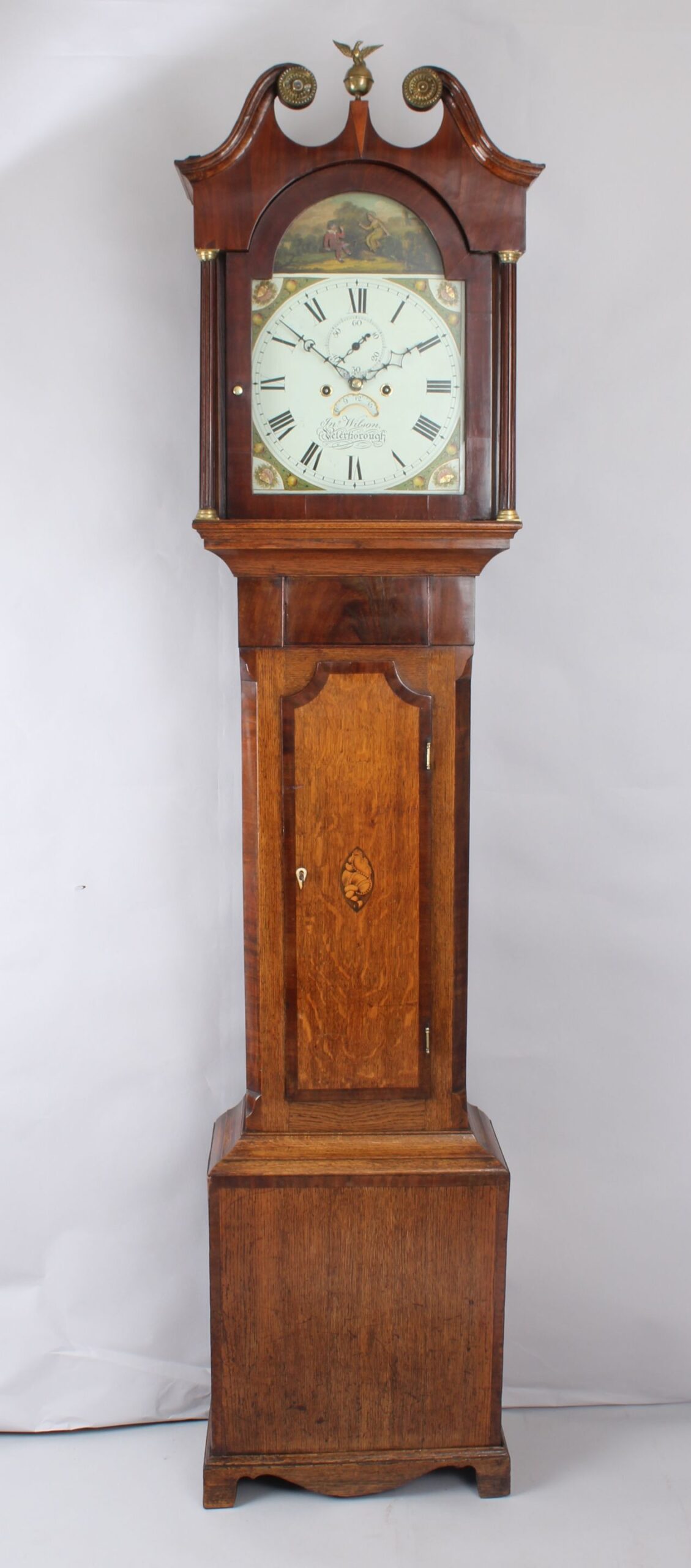 Early nineteenth century golden-oak and mahogany long-case clock