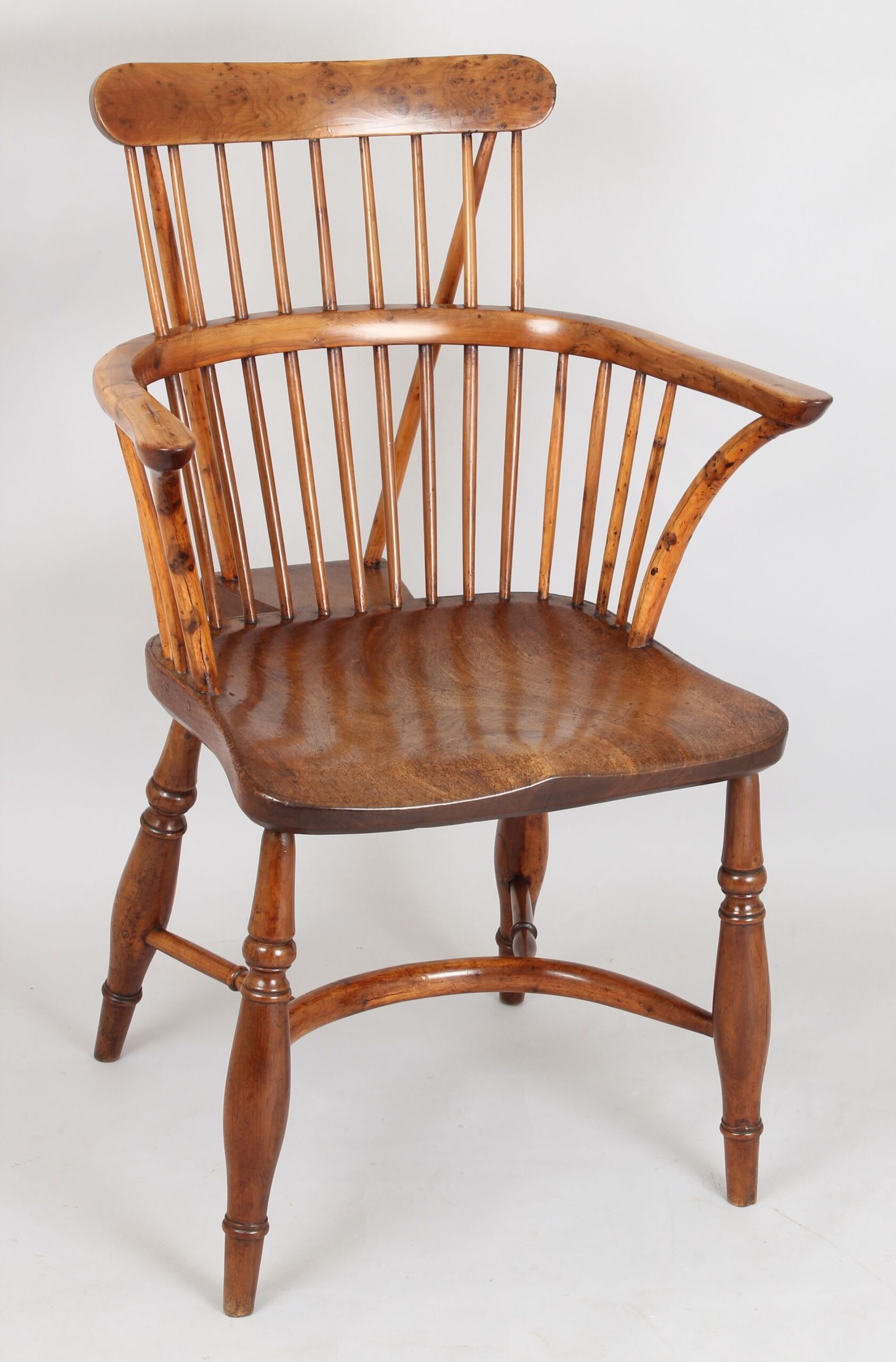 Very fine early 19th century yew-wood comb-back Windsor arm-chair