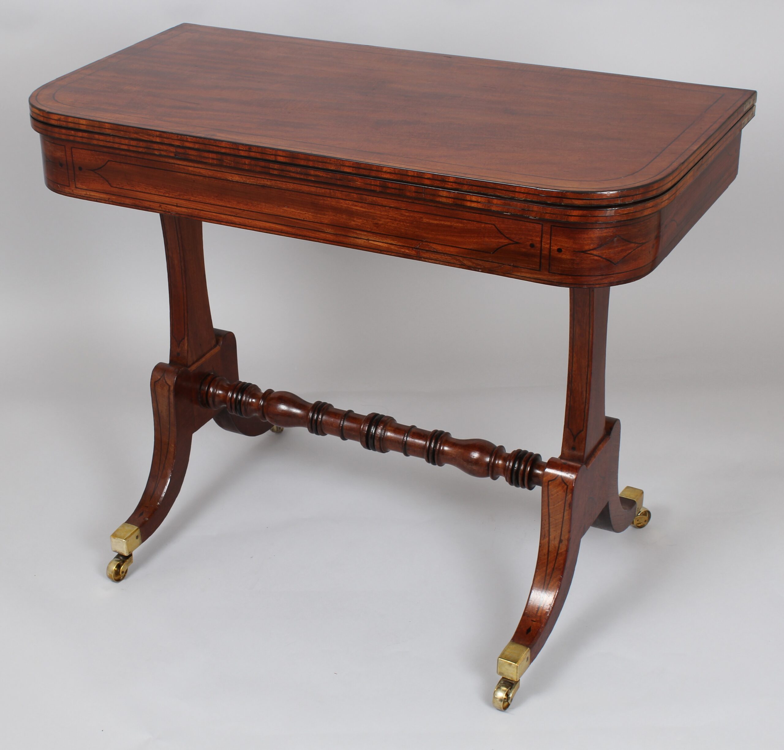 A Regency period mahogany card table