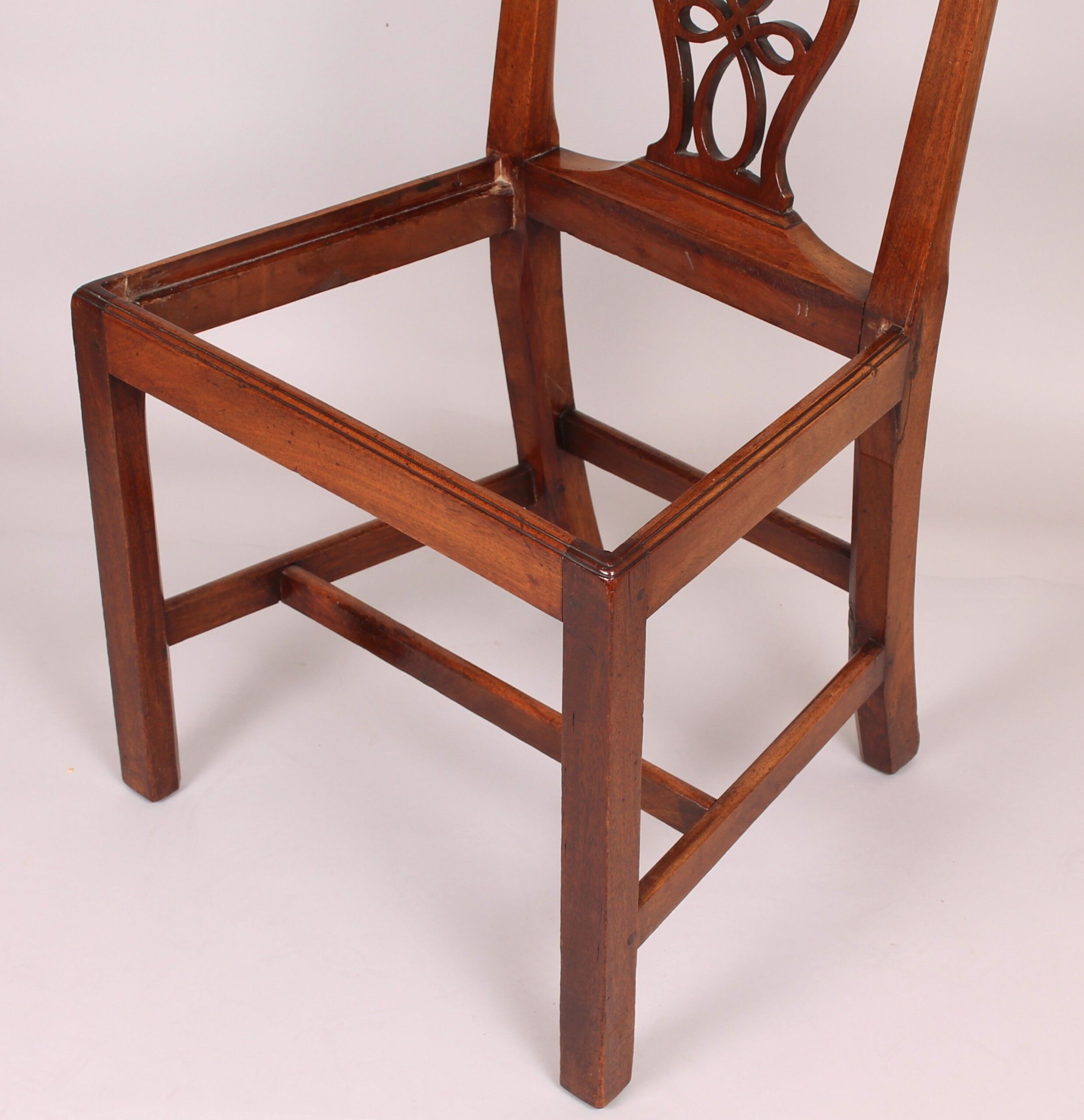 Set of four George III period walnut ‘Country Chippendale’ dining-chairs