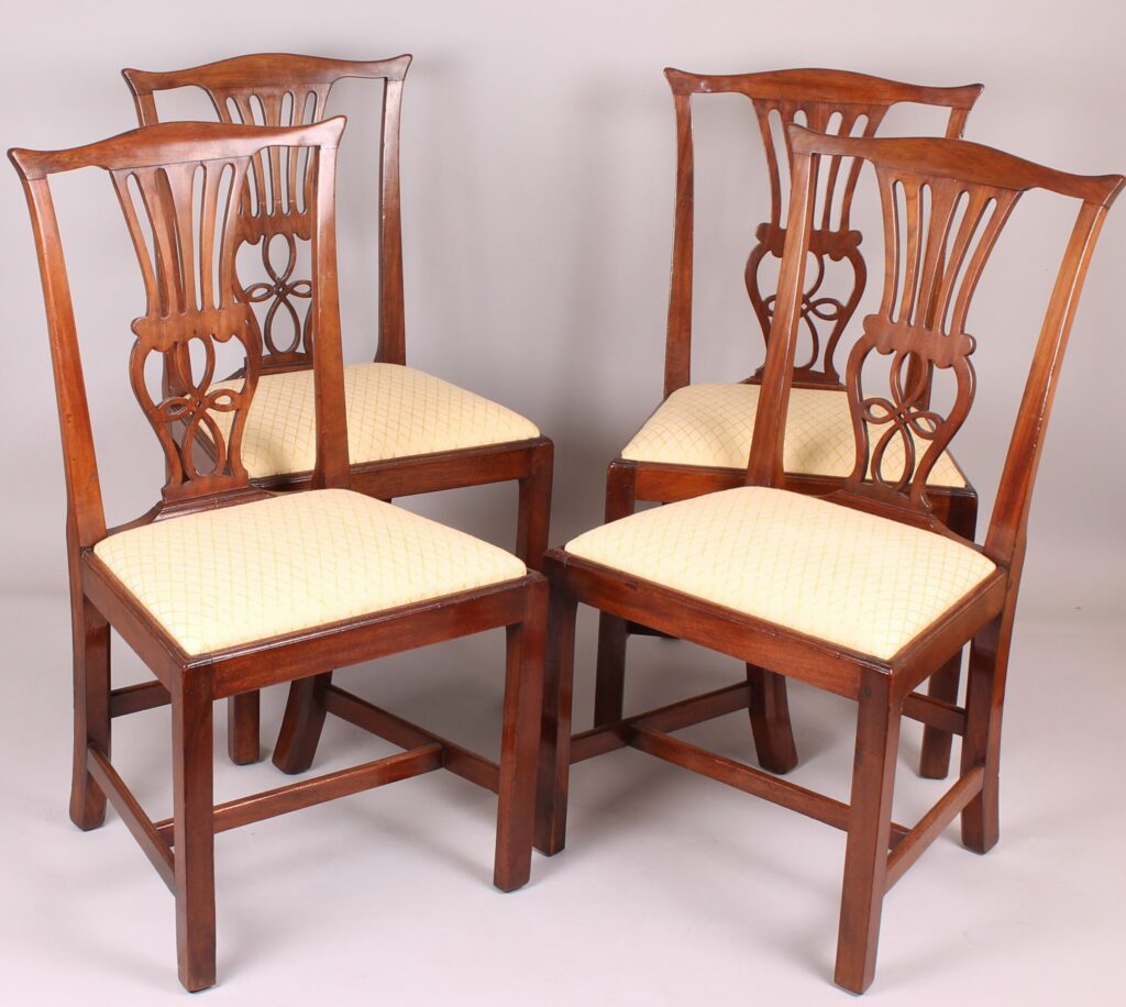 Set of four George III period walnut ‘Country Chippendale’ dining-chairs