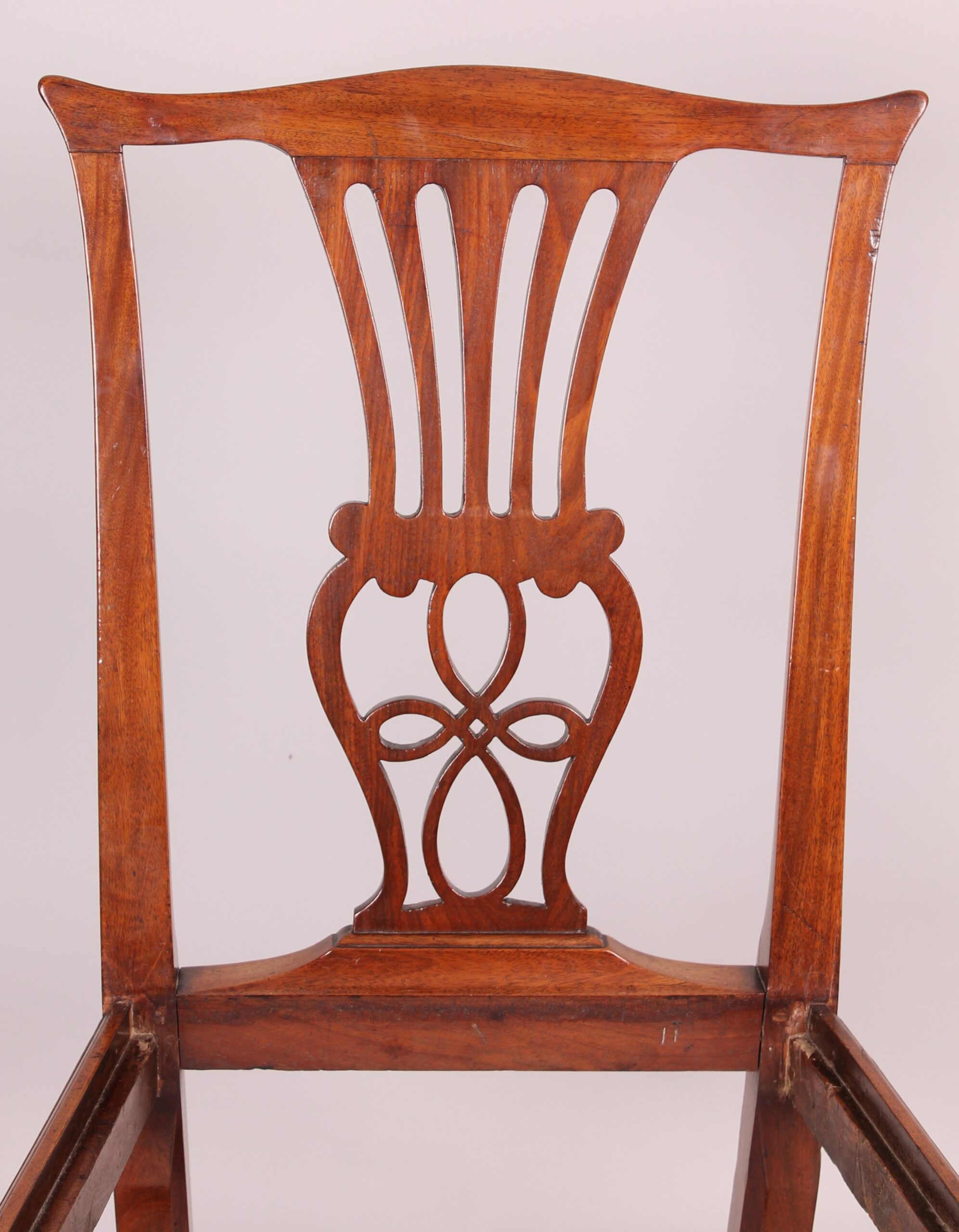 Set of four George III period walnut ‘Country Chippendale’ dining-chairs