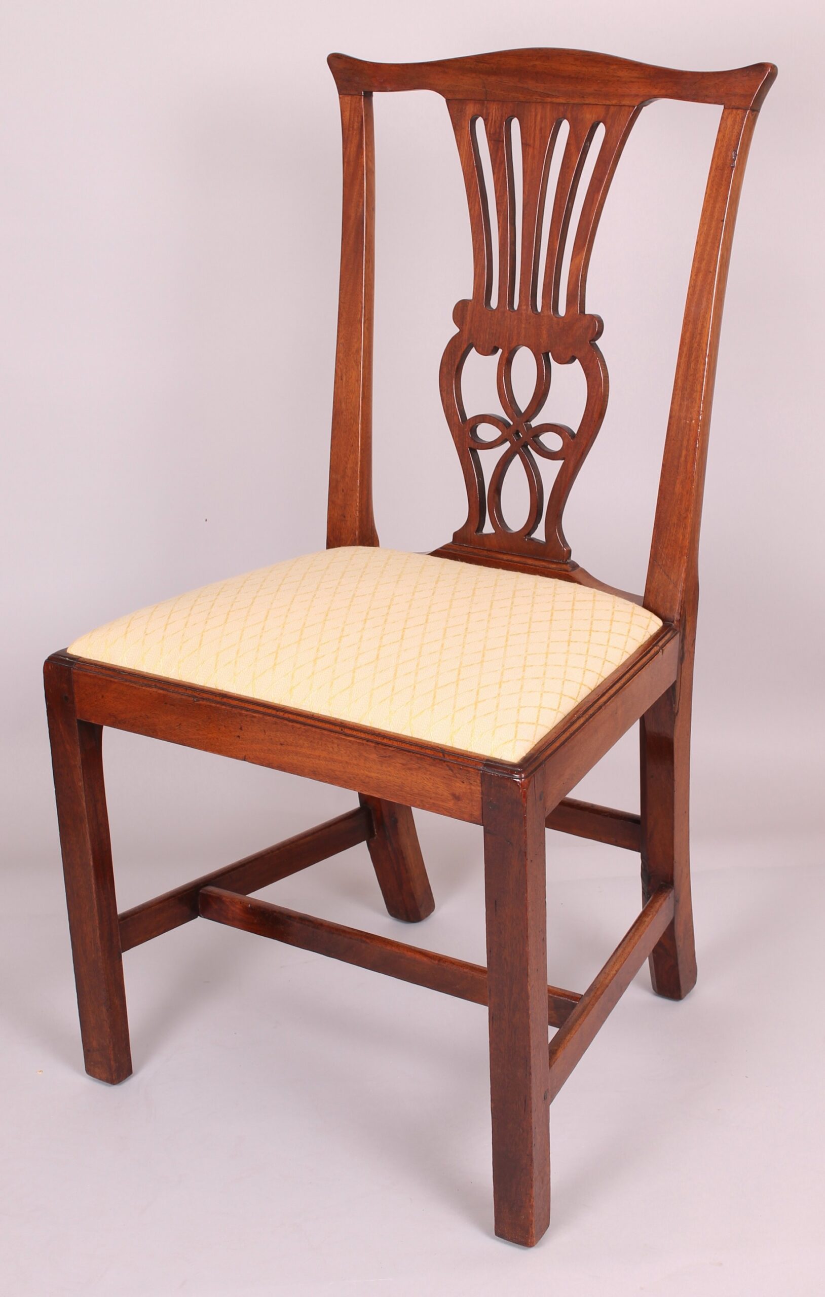 Set of four George III period walnut ‘Country Chippendale’ dining-chairs