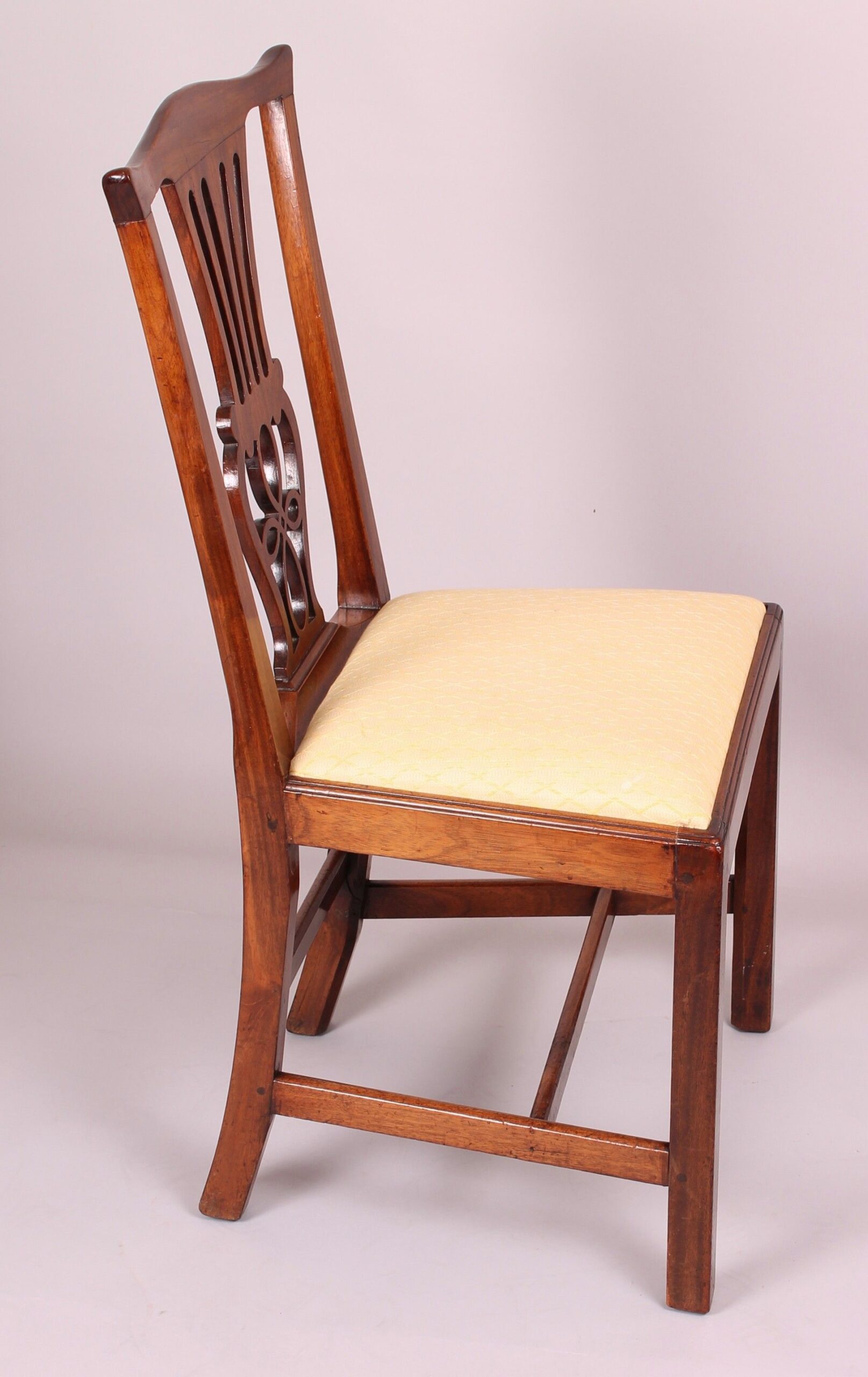 Set of four George III period walnut ‘Country Chippendale’ dining-chairs